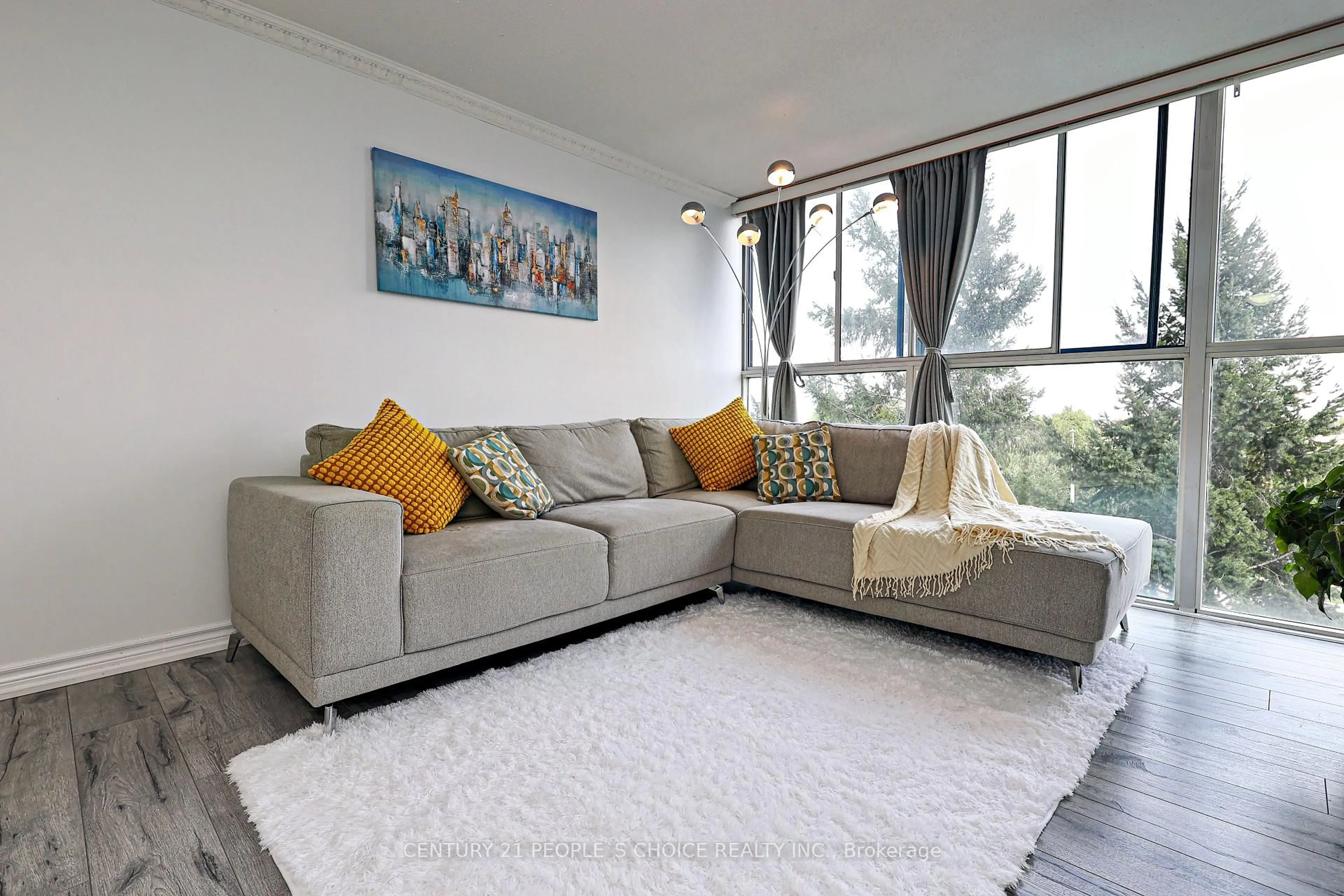 Living room with furniture, carpet floor for 35 Trailwood Dr #411, Mississauga Ontario L4Z 3K9