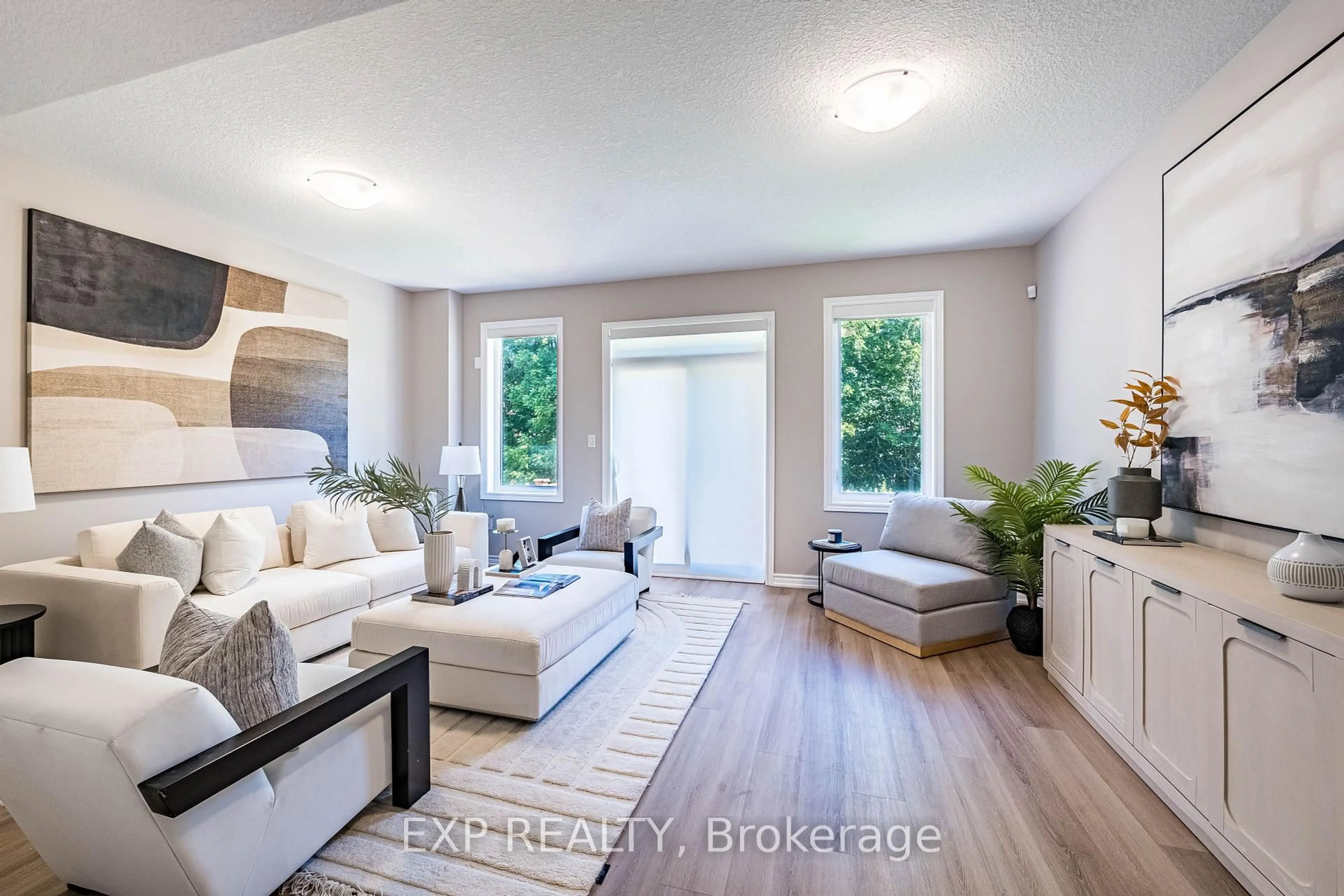 Living room with furniture, wood/laminate floor for 445 Ontario St #14, Milton Ontario L9T 9K2