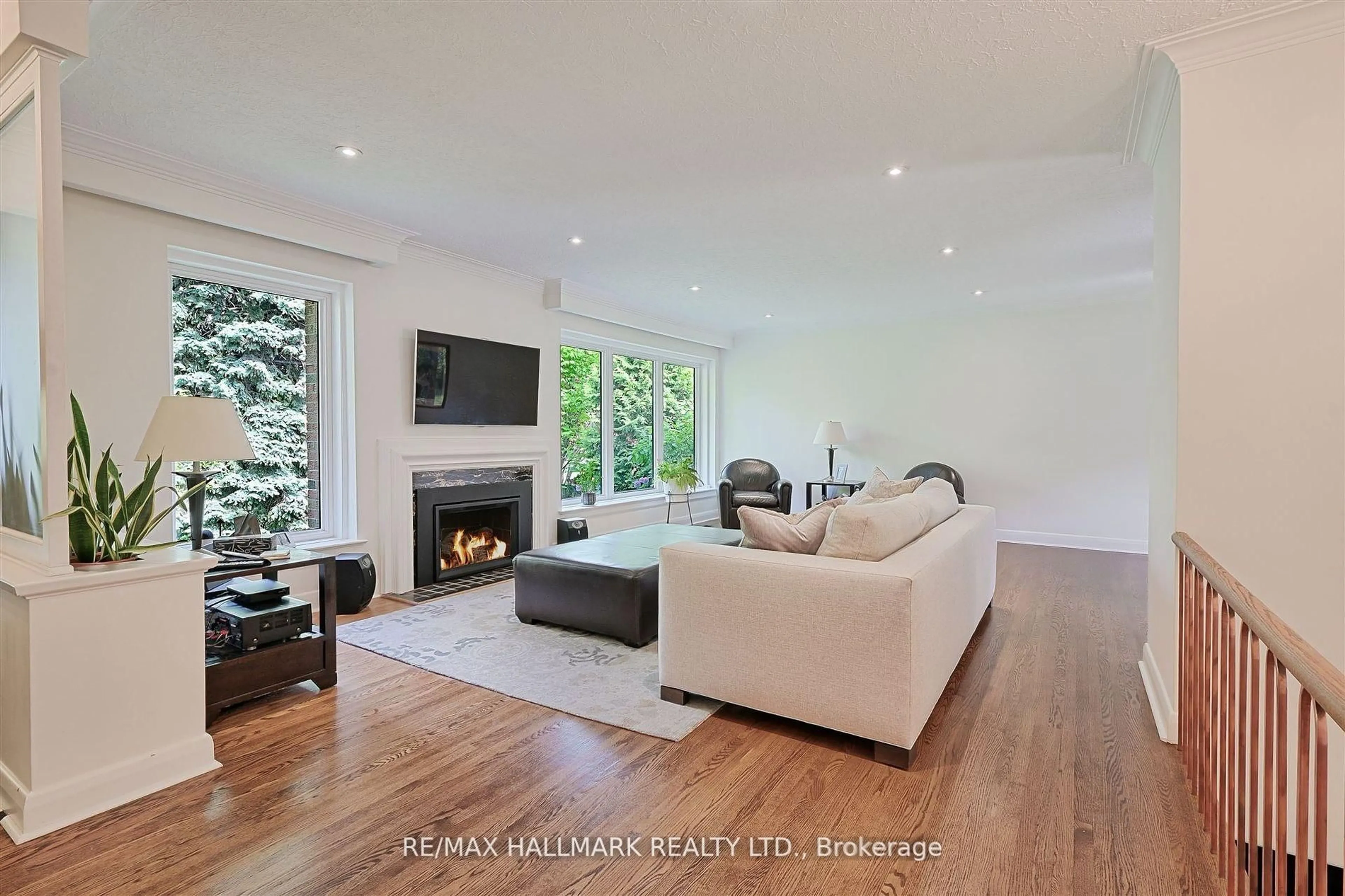 Living room with furniture, wood/laminate floor for 1616 Islington Ave, Toronto Ontario M9A 3M6