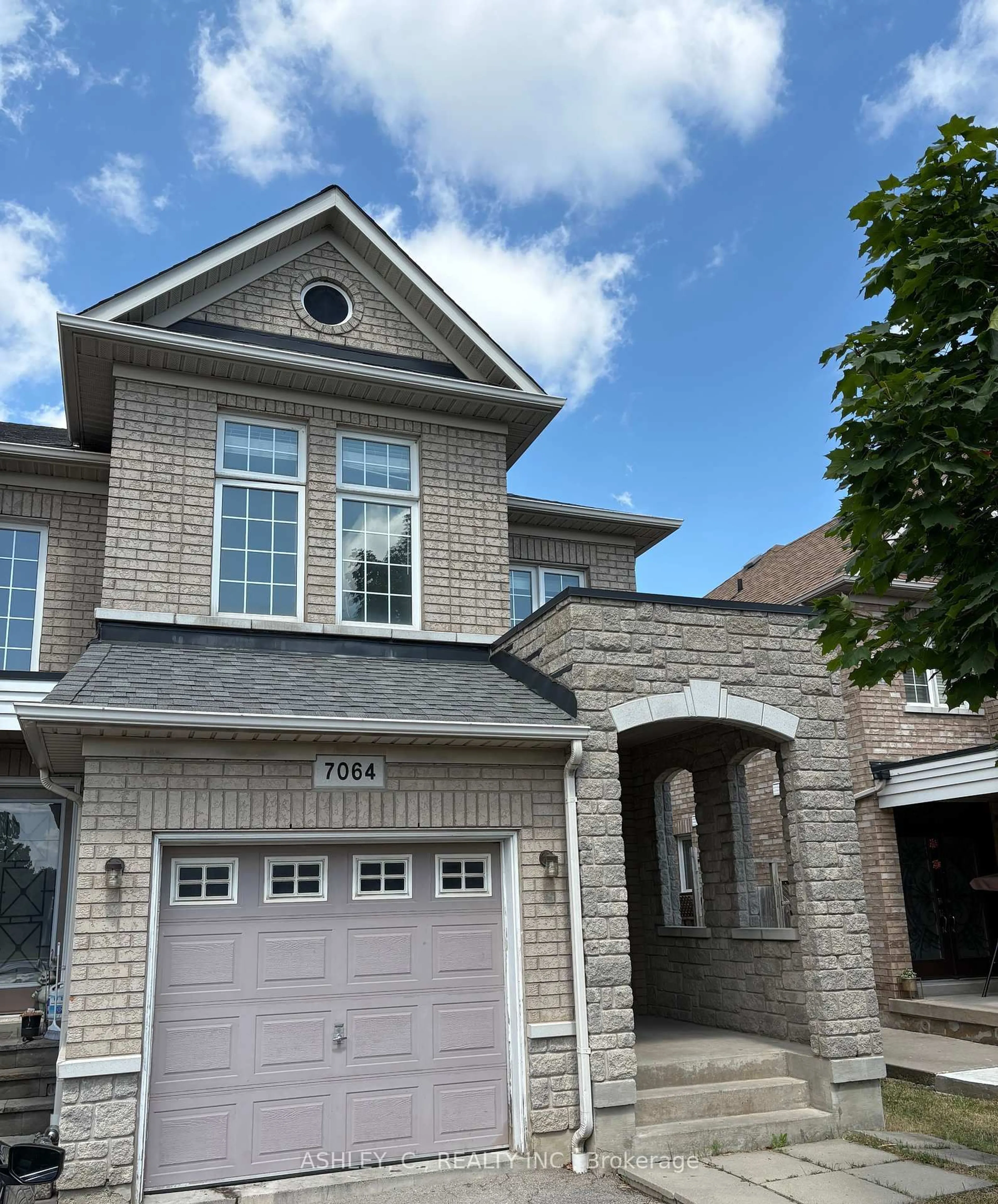 Home with brick exterior material, street for 7064 Village Walk Dr, Mississauga Ontario L5W 1X5