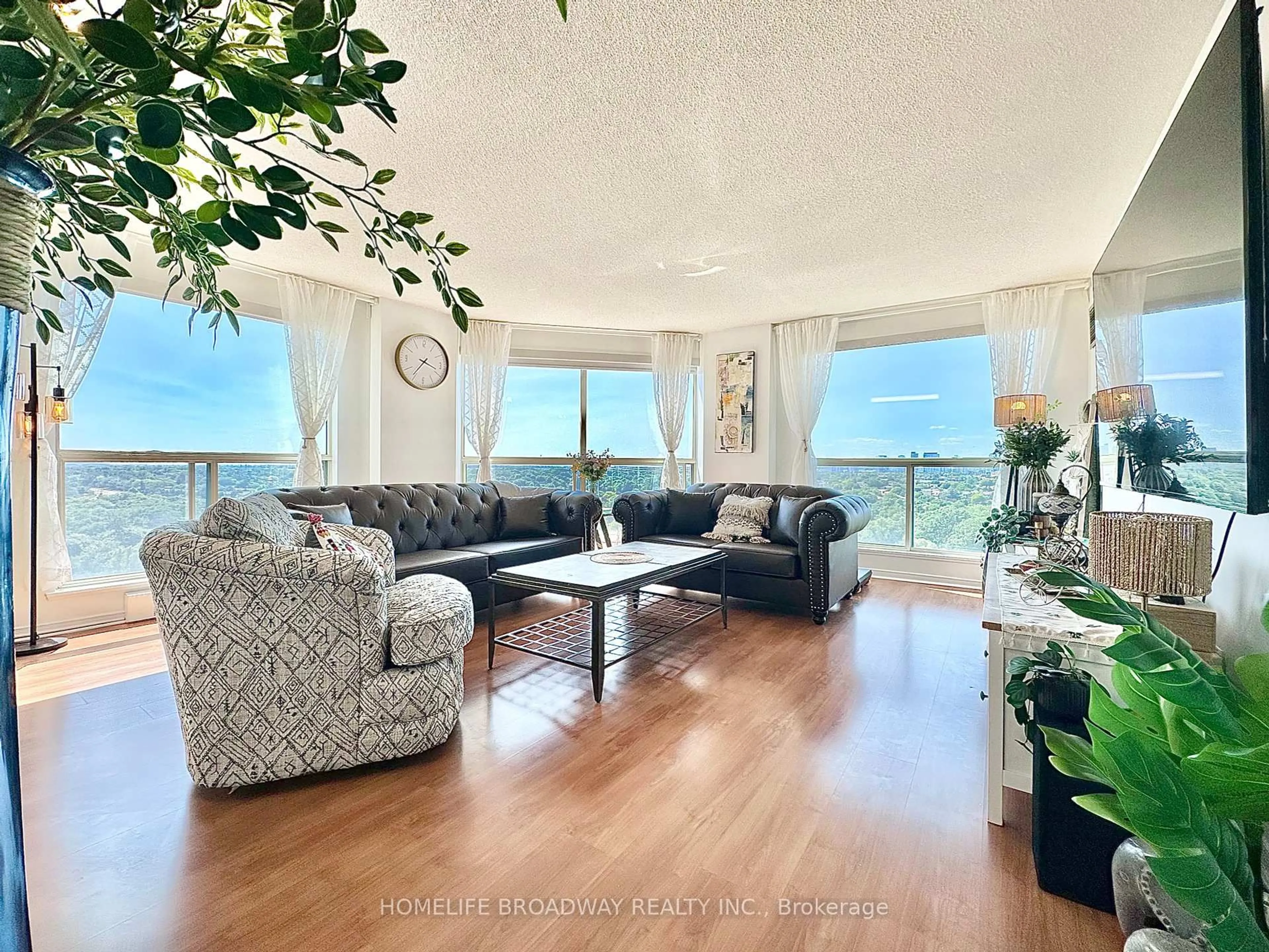 Living room with furniture, wood/laminate floor for 2155 Burnhamthorpe Rd #1709, Mississauga Ontario L5L 5P4