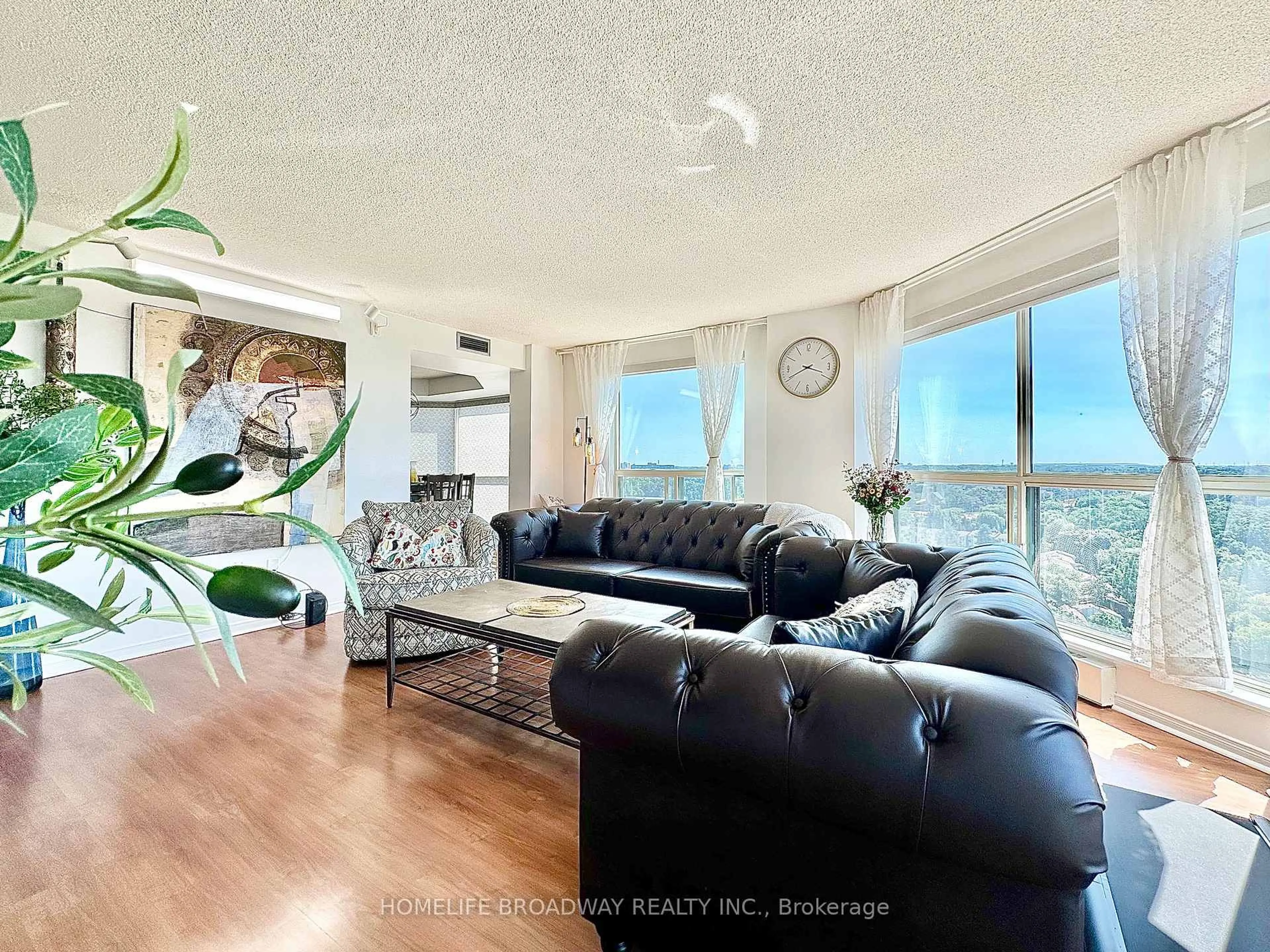 Living room with furniture, wood/laminate floor for 2155 Burnhamthorpe Rd #1709, Mississauga Ontario L5L 5P4