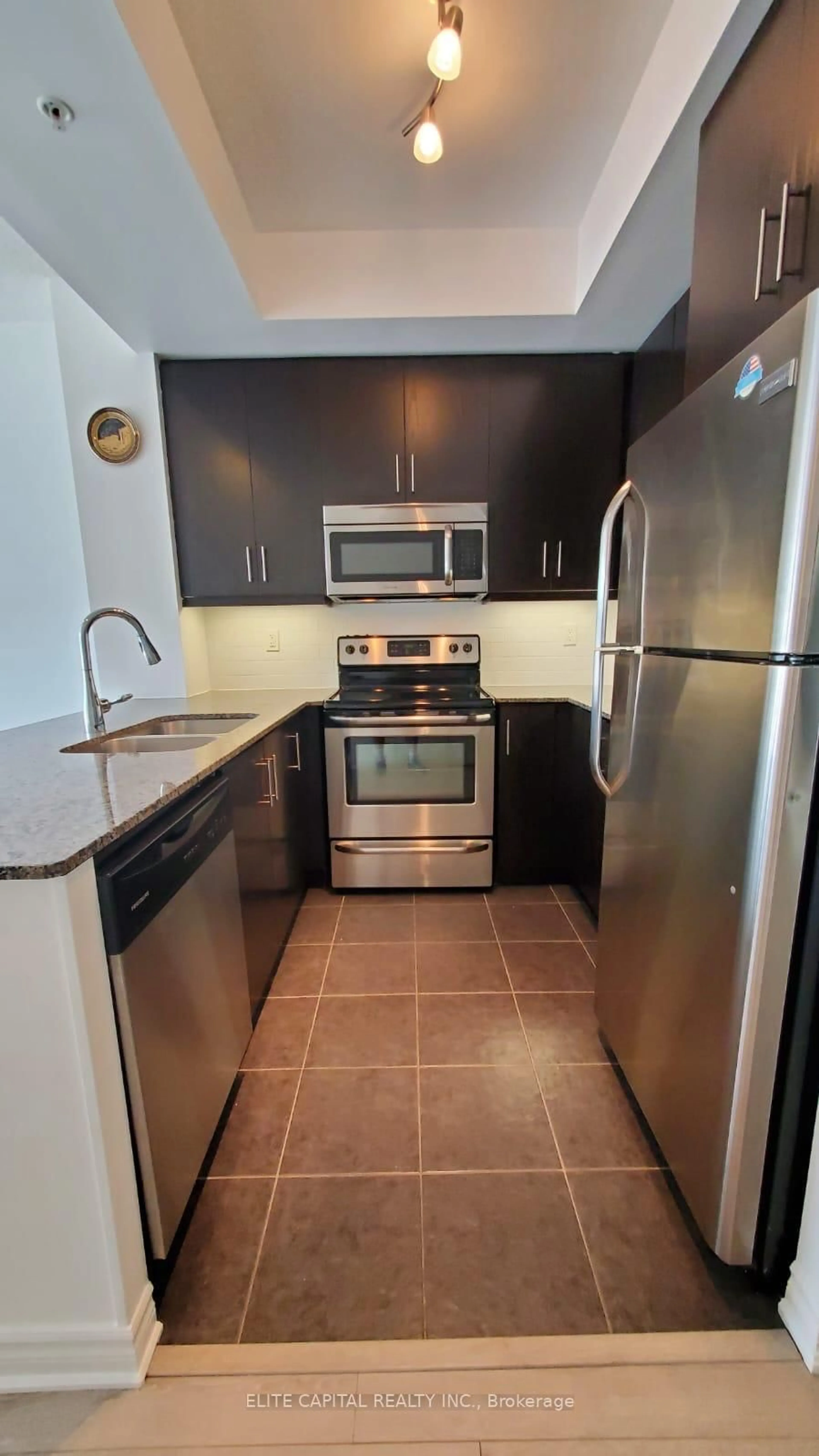 Standard kitchen, ceramic/tile floor for 15 James Finlay Way #904, Toronto Ontario M3M 0B3
