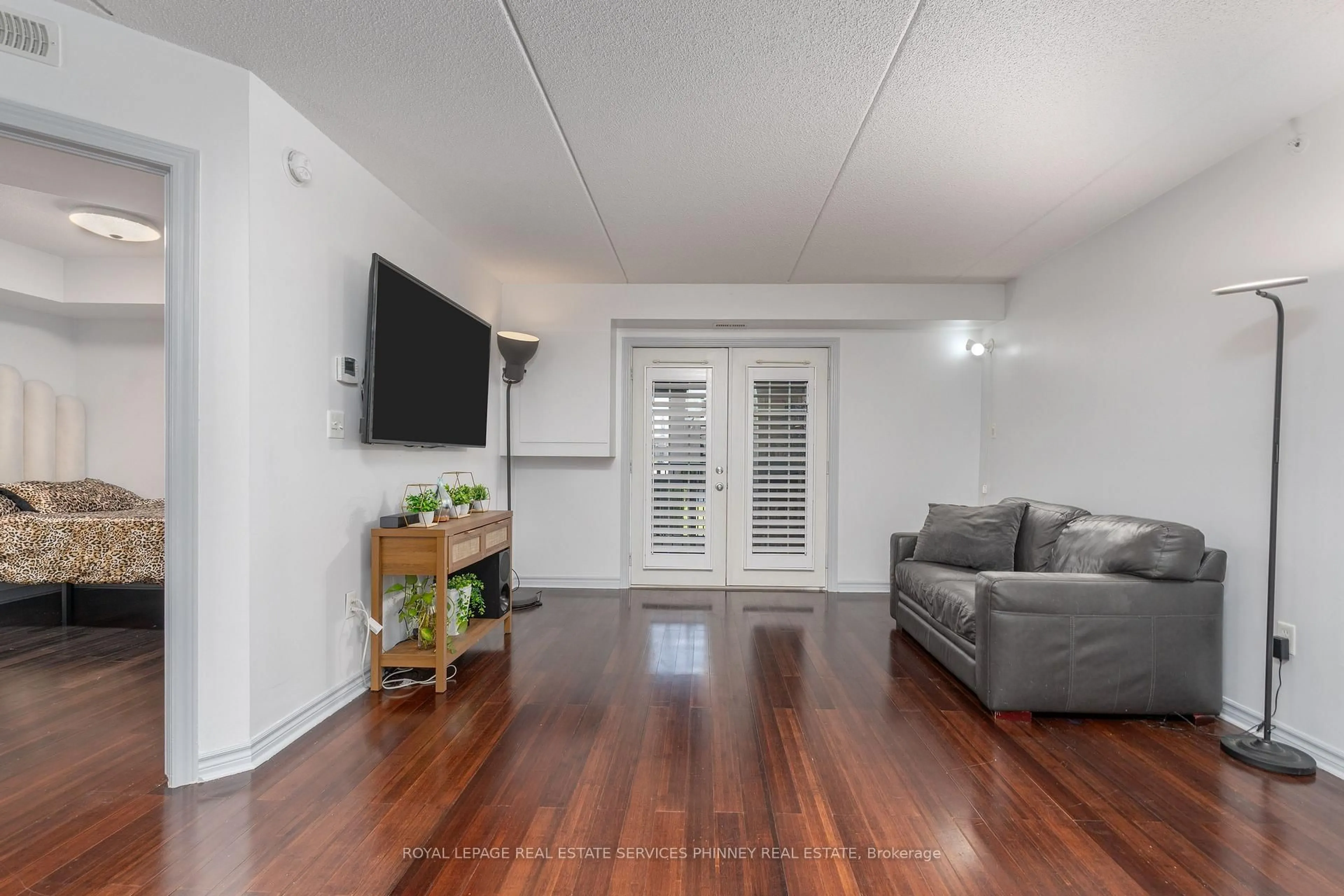 Living room with furniture, unknown for 1350 Main St #208, Milton Ontario L9T 7S7