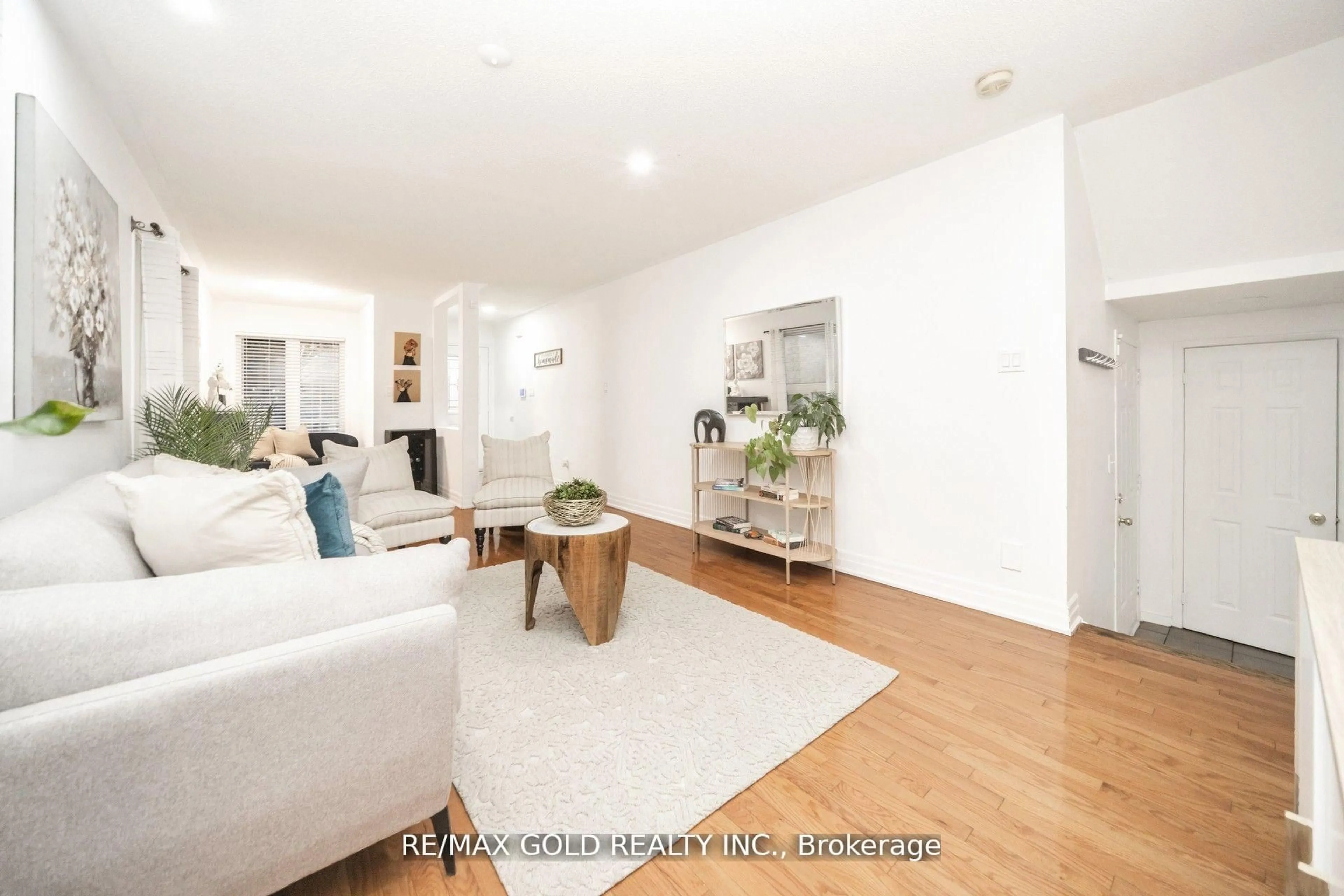 Living room with furniture, wood/laminate floor for 36 Roxton Cres, Brampton Ontario L7A 2A9