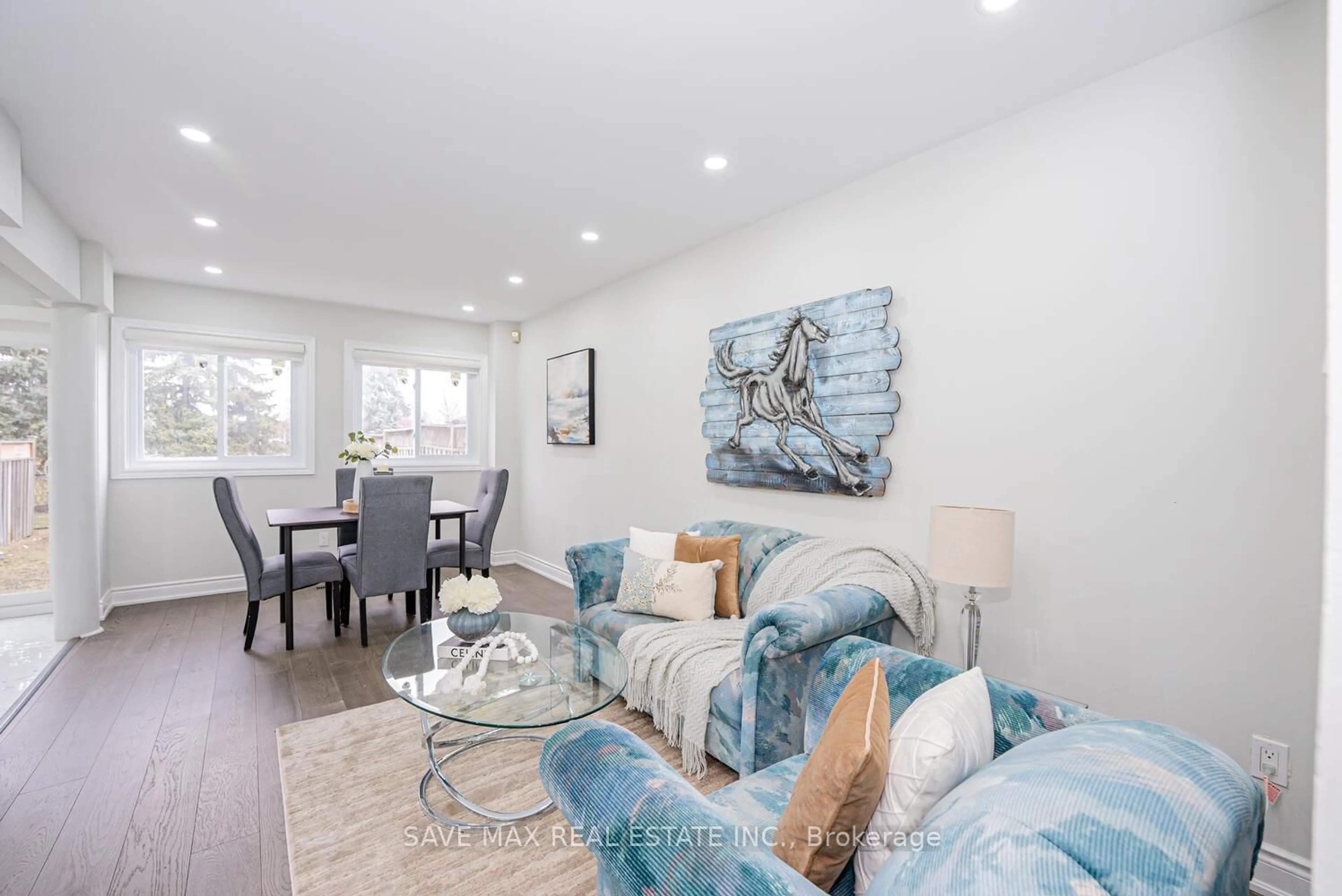Living room with furniture, wood/laminate floor for 92 Cedarwood Cres, Brampton Ontario L6X 4K2