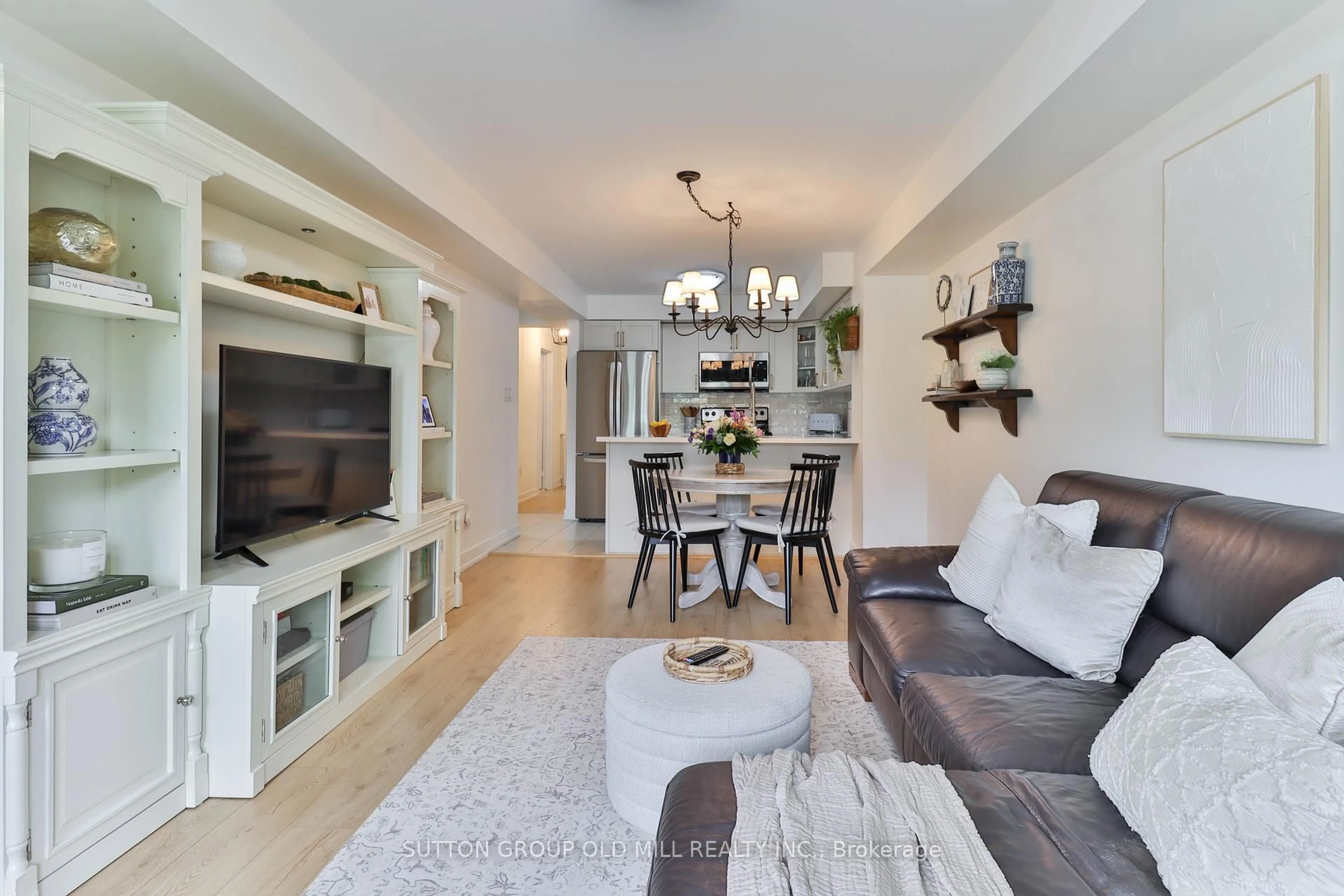Living room with furniture, wood/laminate floor for 2335 Sheppard Ave #22, Toronto Ontario M9M 0E9