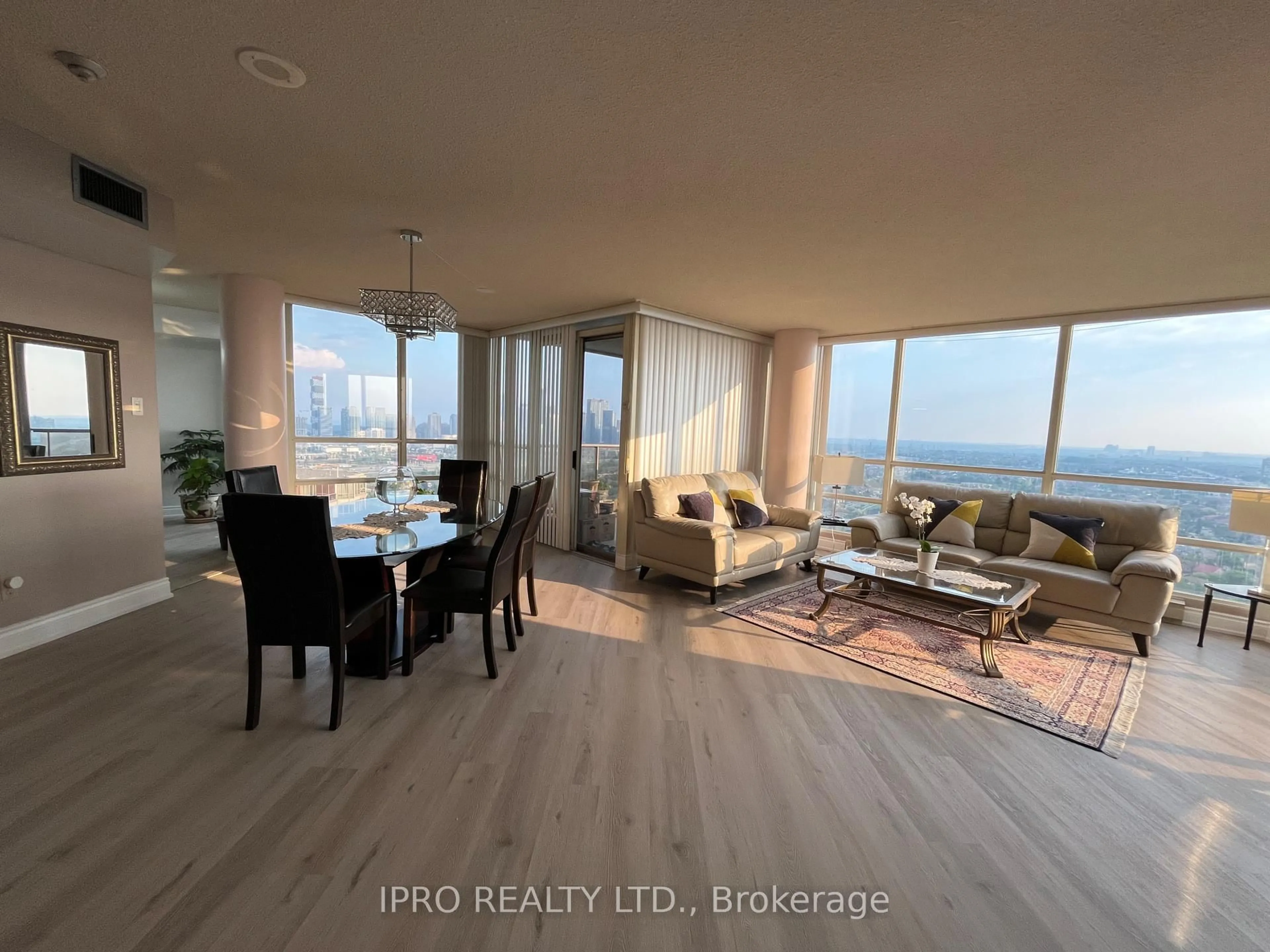 Living room with furniture, wood/laminate floor for 45 Kingsbridge Garden Circ #2805, Mississauga Ontario L5R 3K4