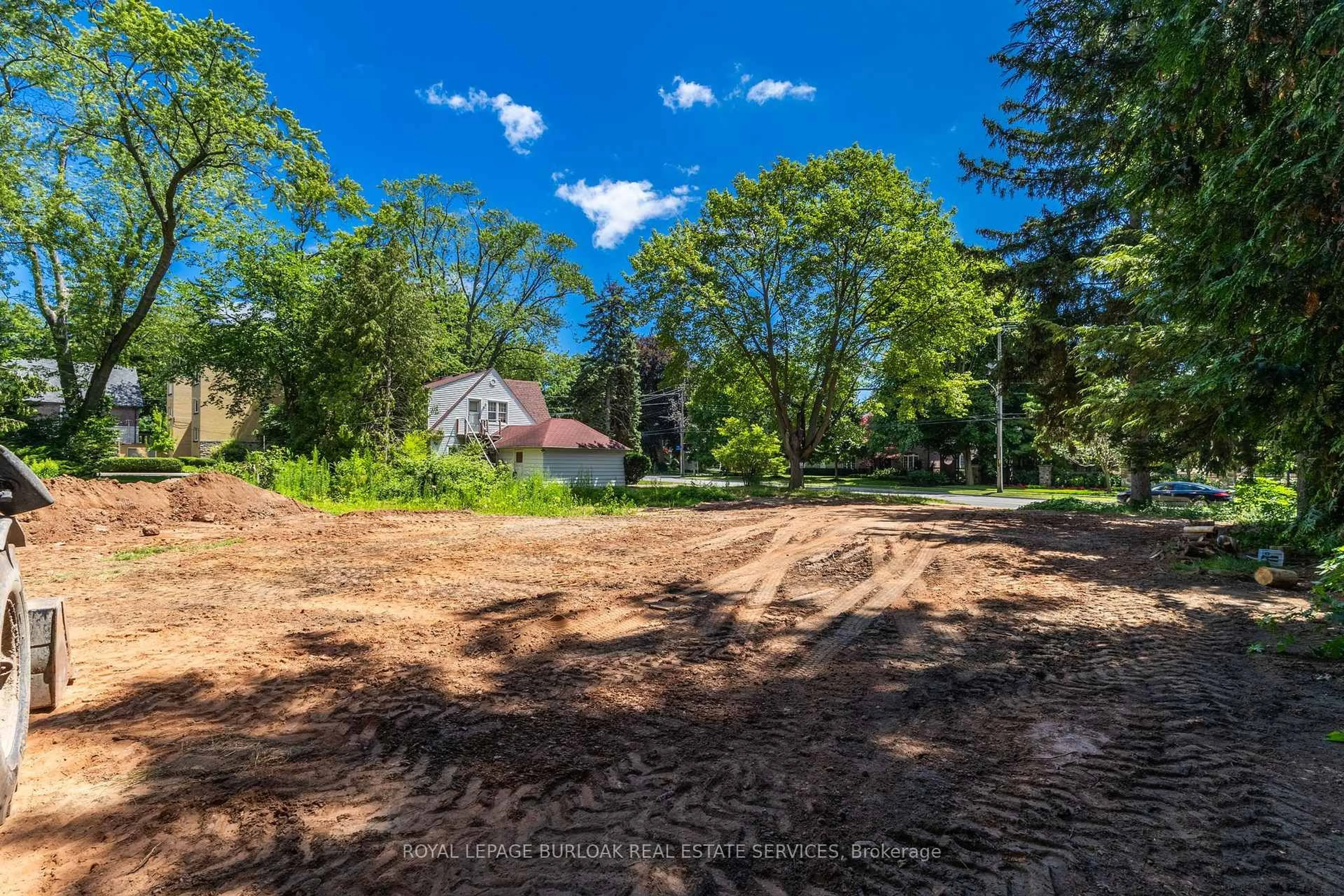 A pic from outside/outdoor area/front of a property/back of a property/a pic from drone, forest/trees view for 2379 Lakeshore Rd, Burlington Ontario L7R 1B7