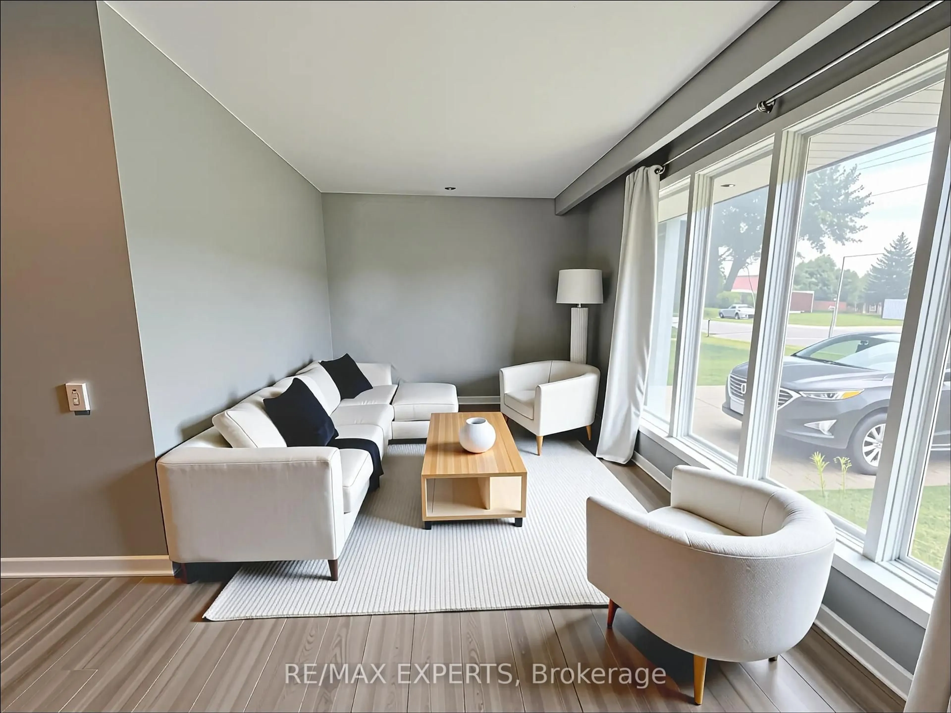 Living room with furniture, wood/laminate floor for 79A Dawson Rd, Orangeville Ontario L9W 2W4