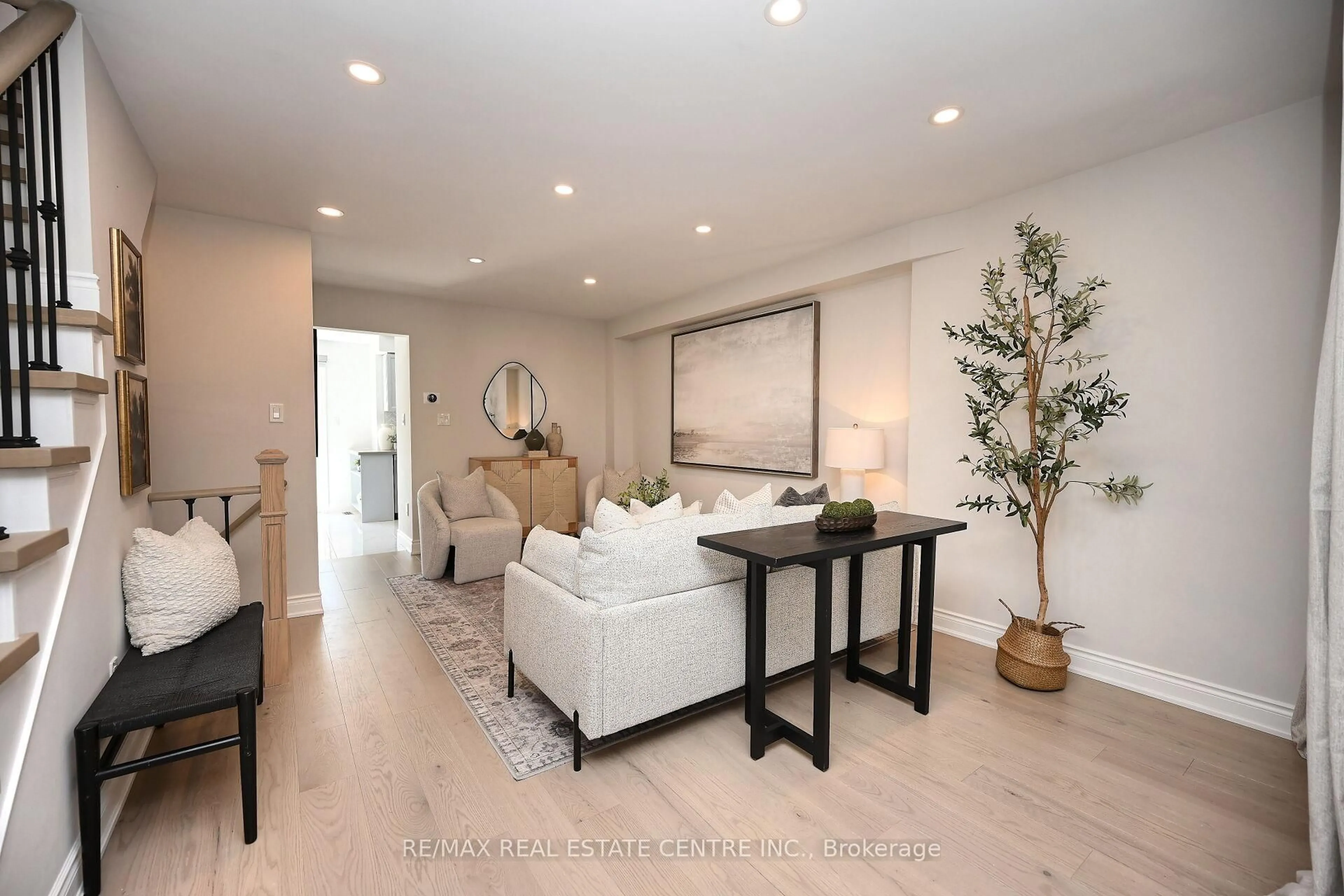 Living room with furniture, wood/laminate floor for 24 Sloan Dr, Milton Ontario L9T 5P7