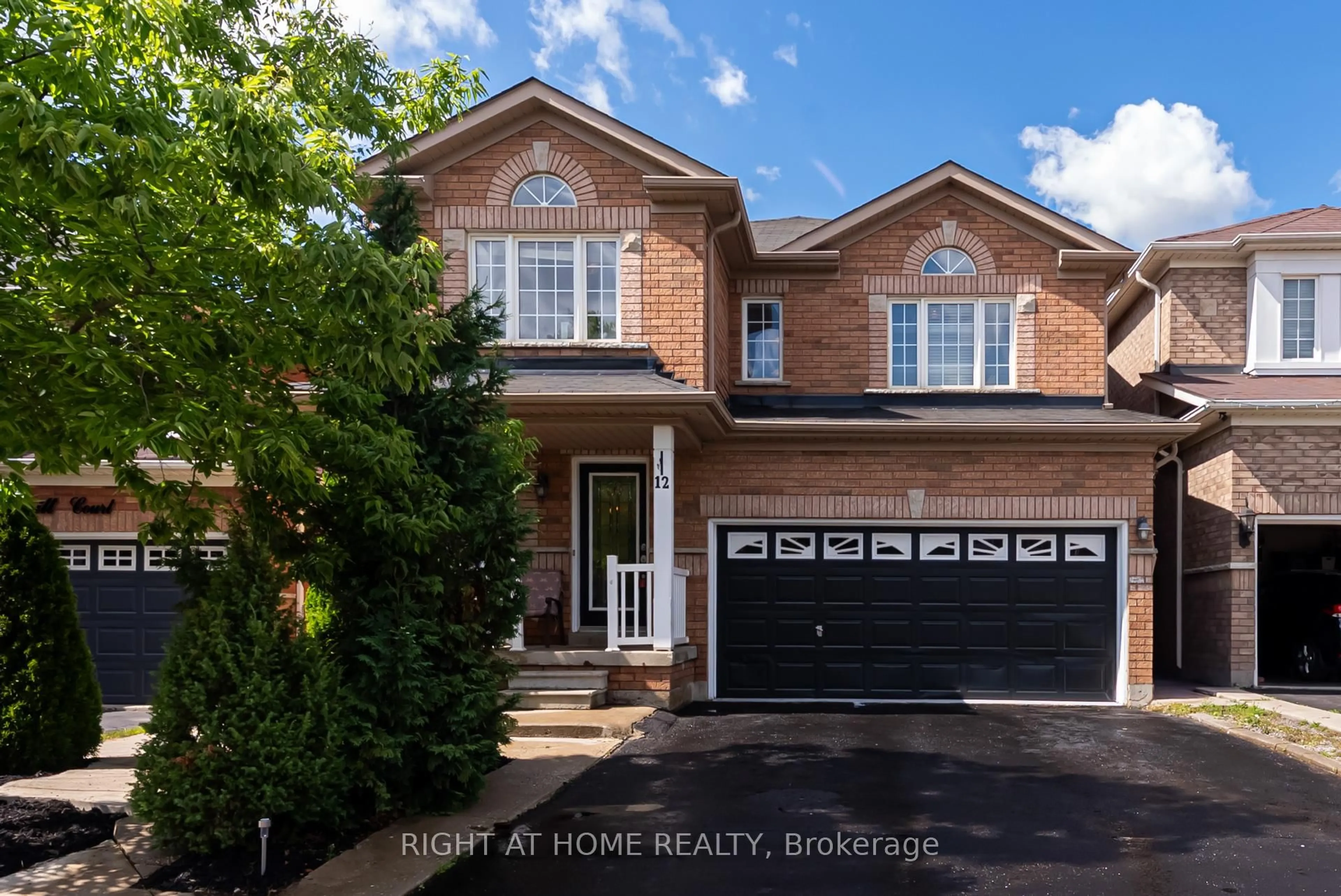 Home with brick exterior material, street for 12 Joywill Crt, Brampton Ontario L7A 3T8