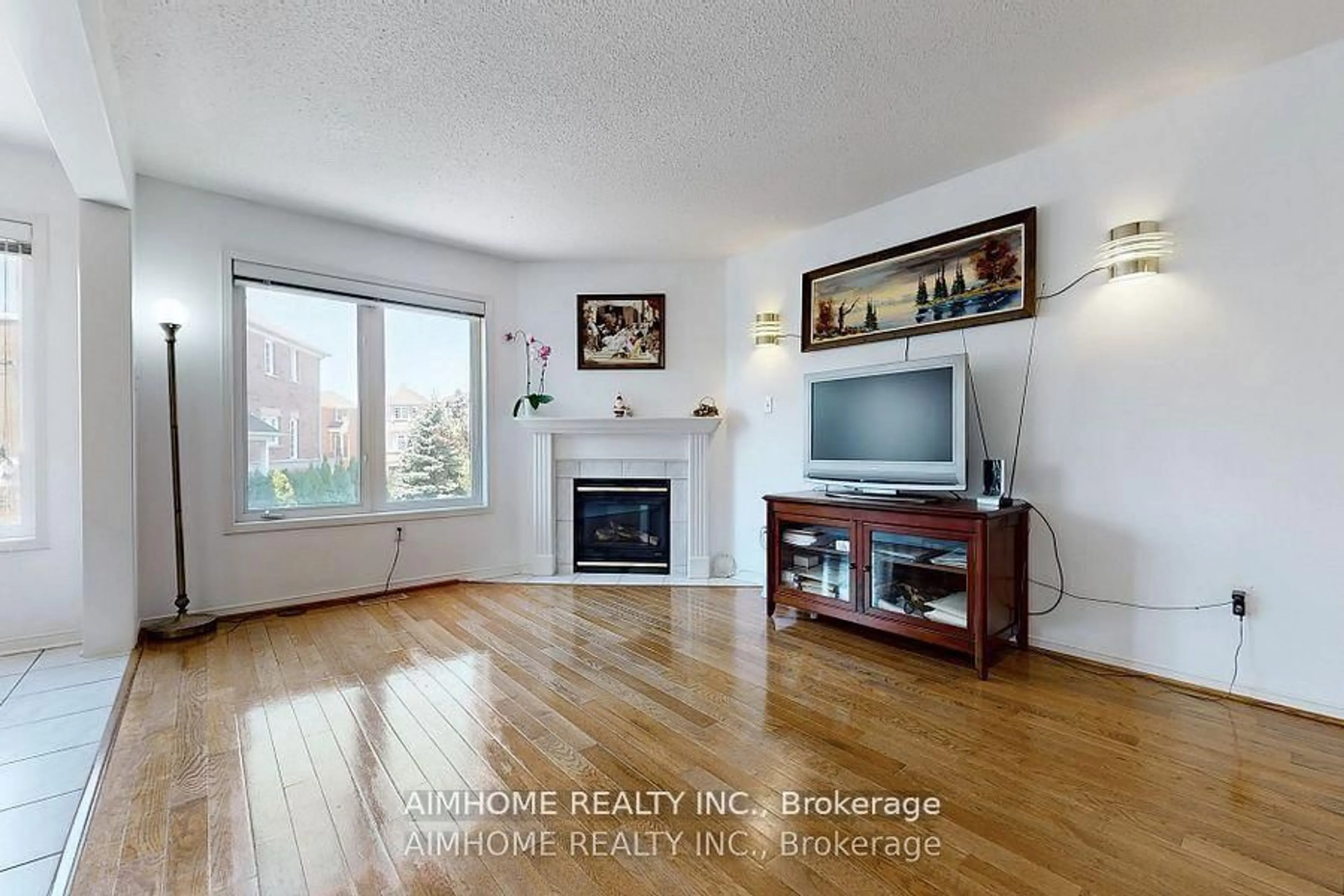 Living room with furniture, wood/laminate floor for 46 Via Torre Dr, Toronto Ontario M6M 5J8