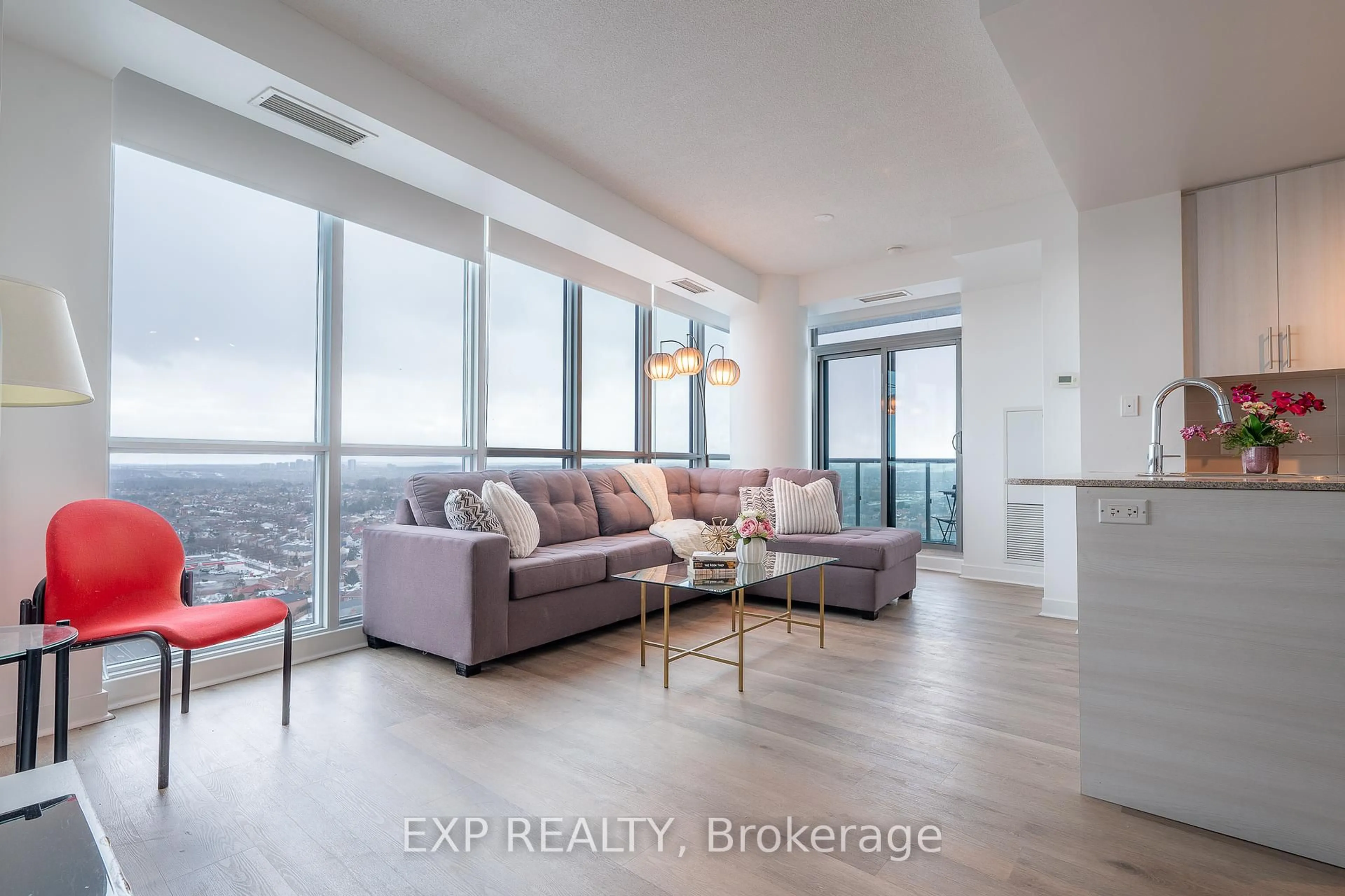 Living room with furniture, wood/laminate floor for 3985 Grand Park Dr #2008, Mississauga Ontario L5B 0H8