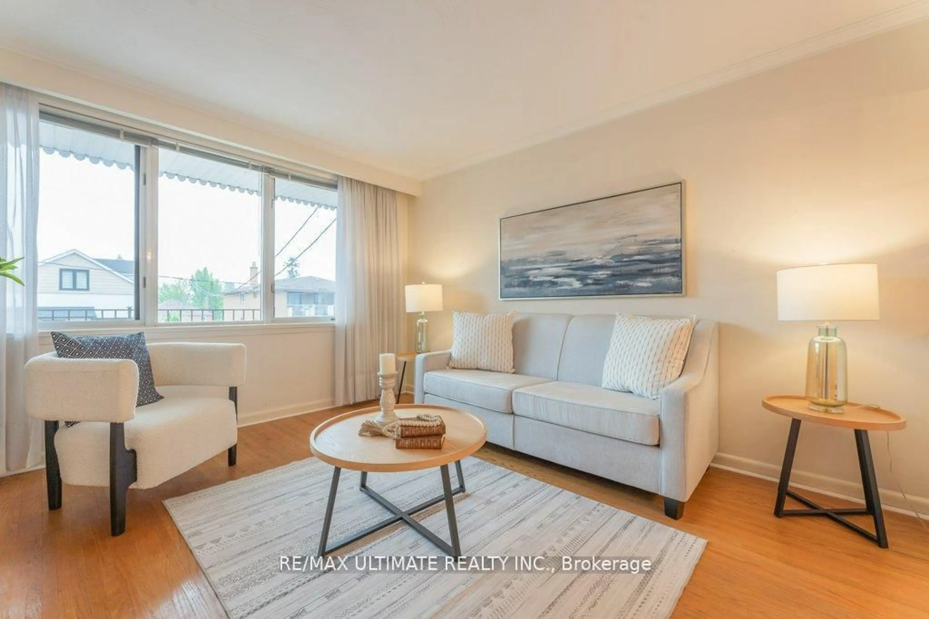 Living room with furniture, wood/laminate floor for 28 Lacey Ave, Toronto Ontario M6M 3L7