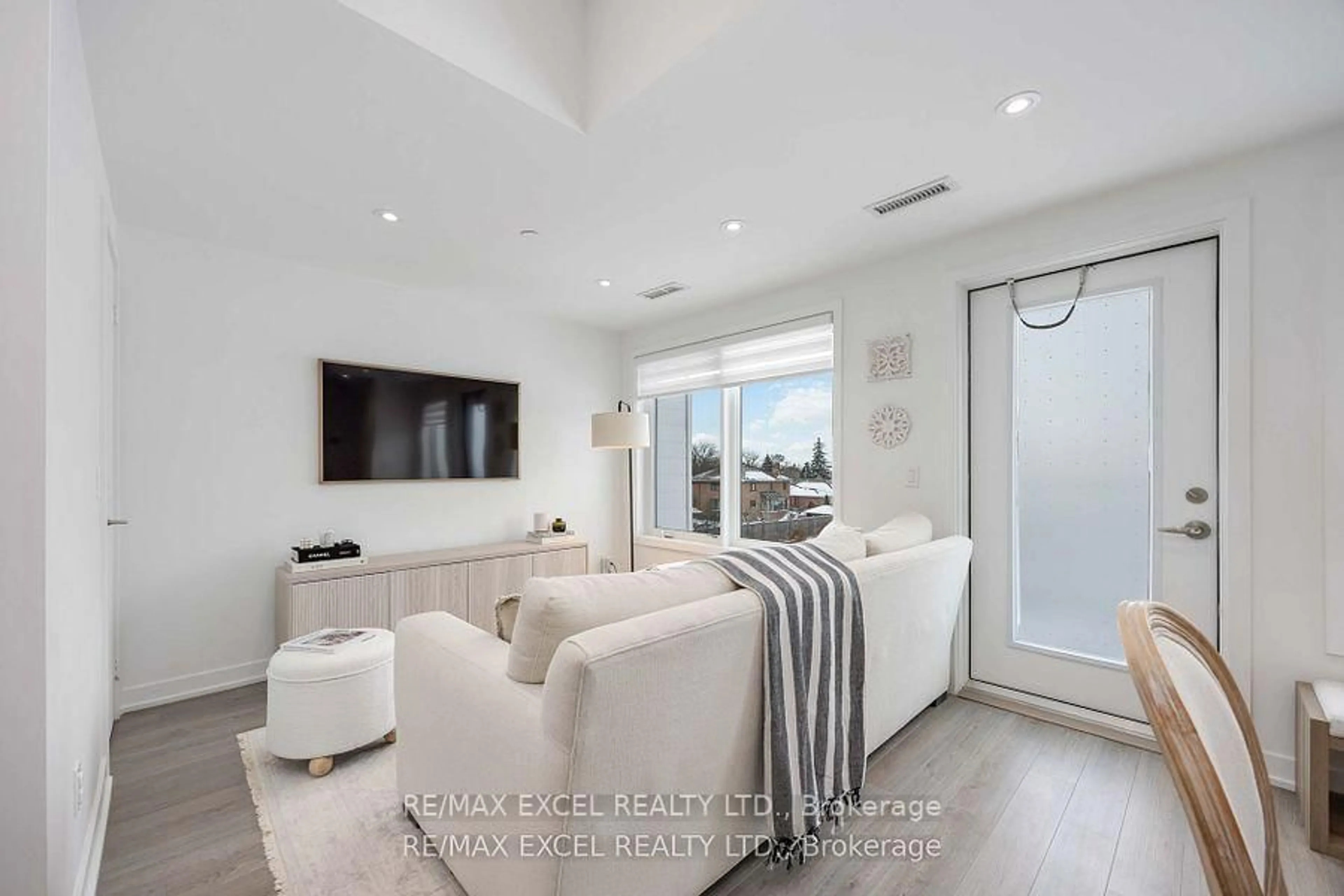 Living room with furniture, ceramic/tile floor for 155 Downsview Park Blvd #208, Toronto Ontario M3K 0E3