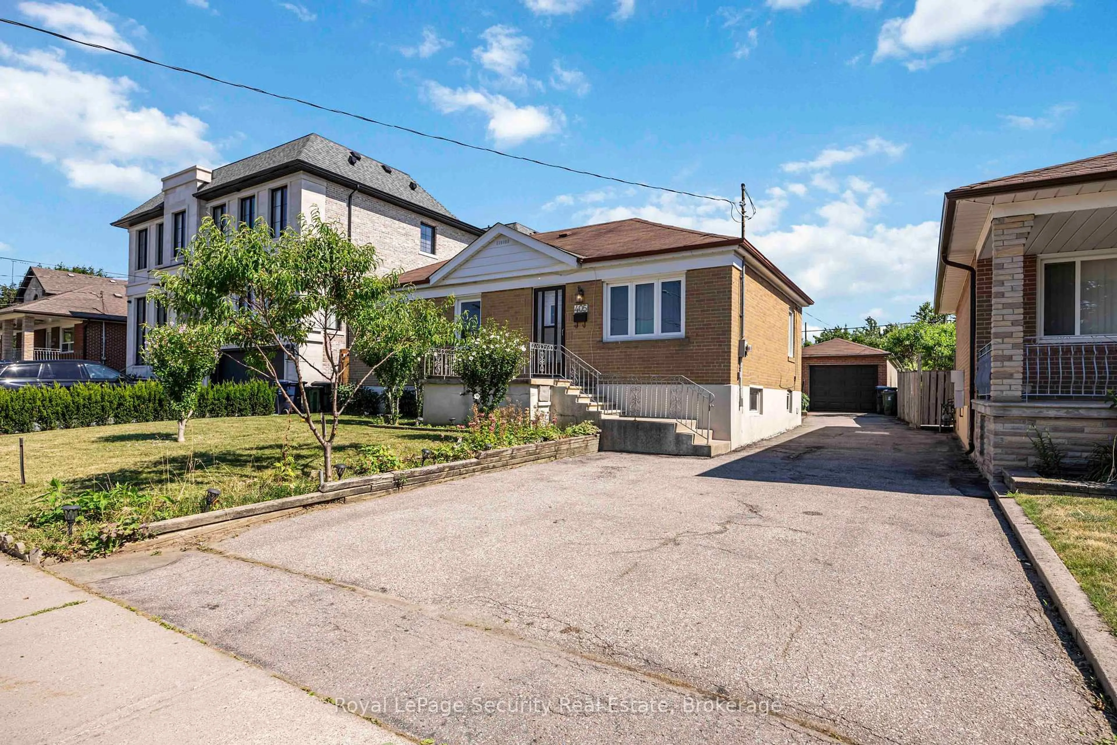 A pic from outside/outdoor area/front of a property/back of a property/a pic from drone, street for 405 Rustic Rd, Toronto Ontario M6L 1W8
