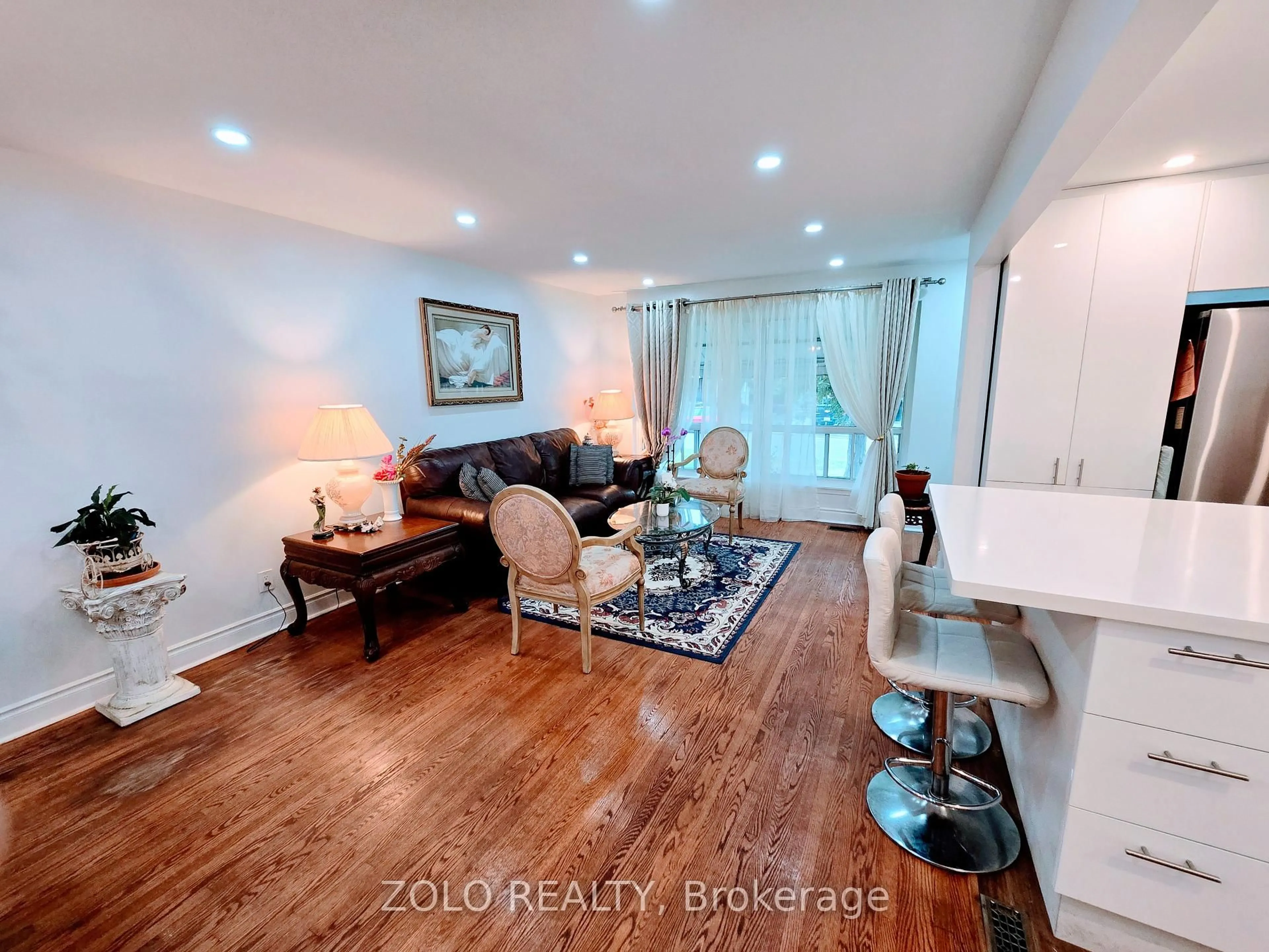 Living room with furniture, wood/laminate floor for 6 Gotham Crt, Toronto Ontario M6M 2N8