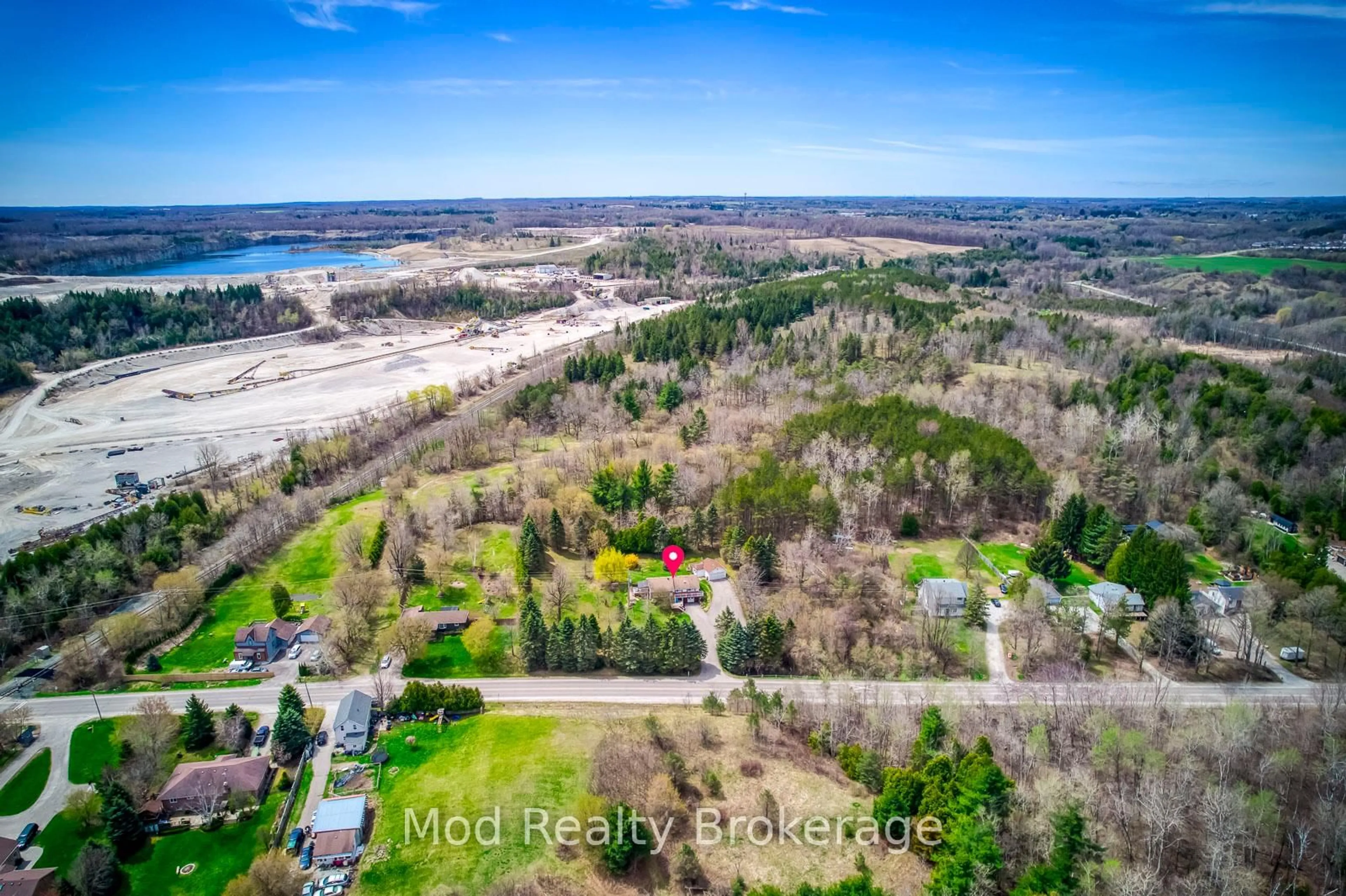 A pic from outside/outdoor area/front of a property/back of a property/a pic from drone, water/lake/river/ocean view for 12638 4 Line, Halton Hills Ontario L7J 2M1