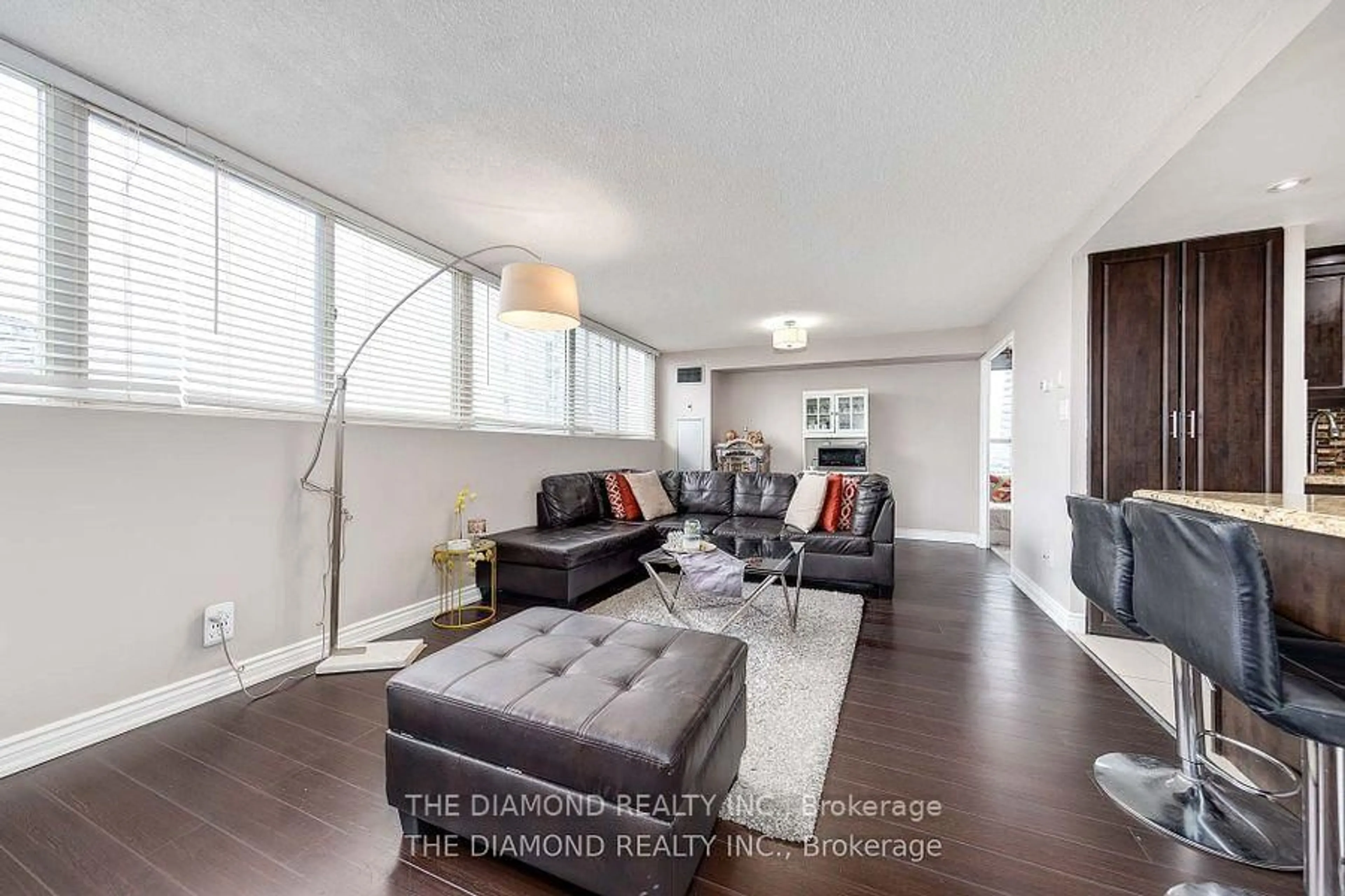 Living room with furniture, wood/laminate floor for 3700 Kaneff Cres #1507, Mississauga Ontario L5A 4B8
