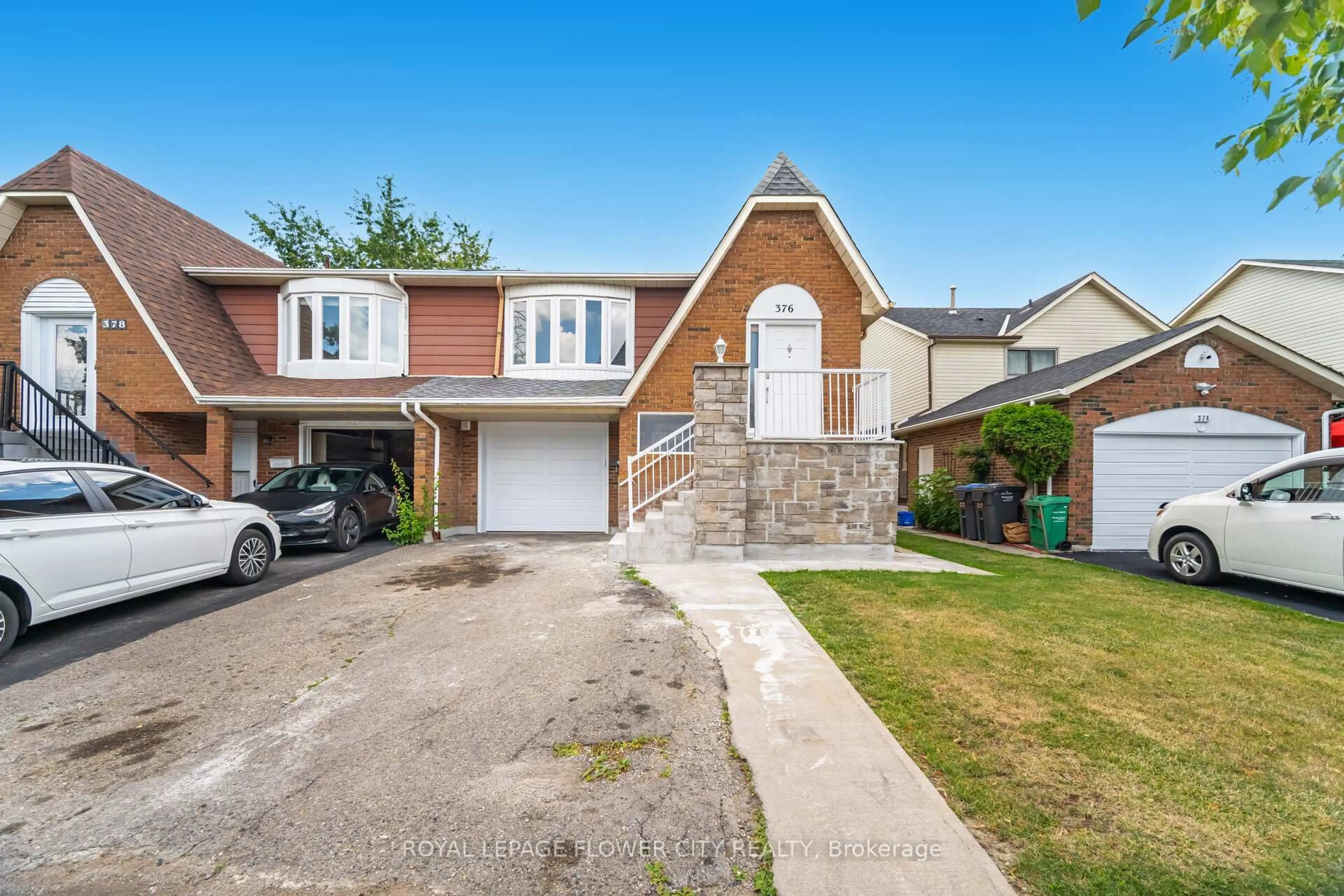 Home with brick exterior material, street for 376 Hansen Rd, Brampton Ontario L6V 3P7