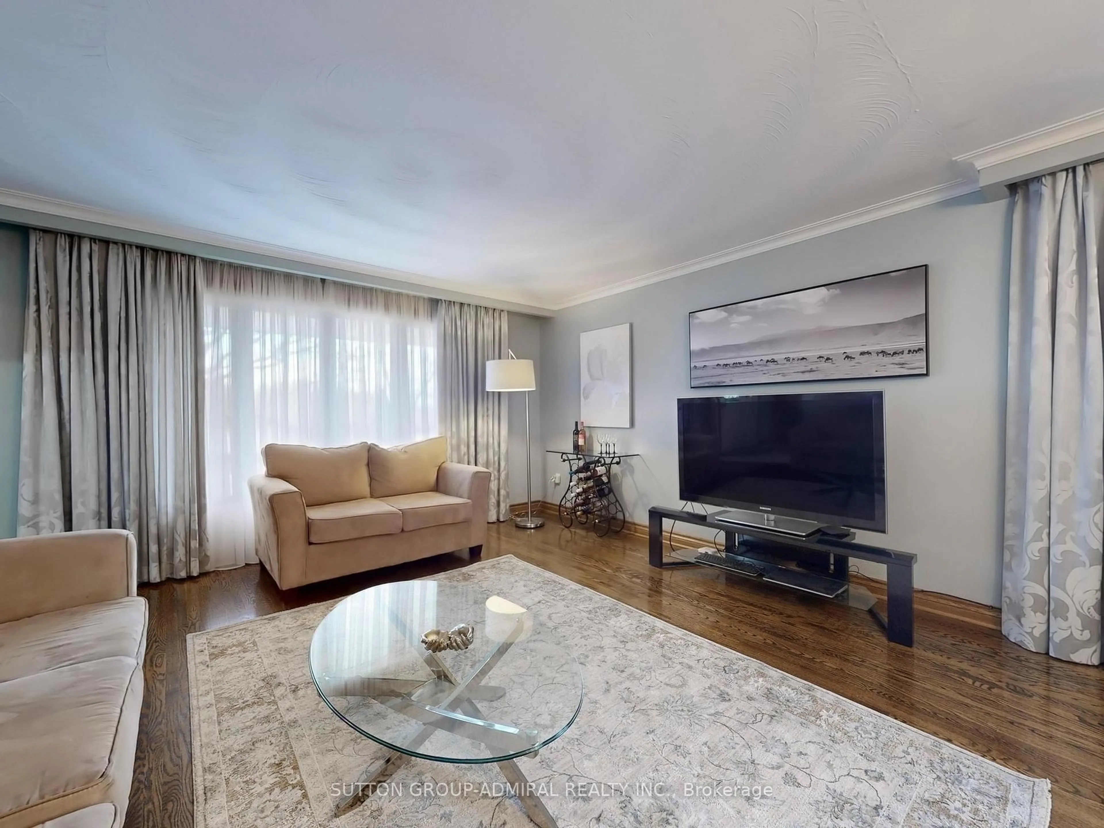 Living room with furniture, wood/laminate floor for 36 Bluehaven Cres, Toronto Ontario M9M 1W5