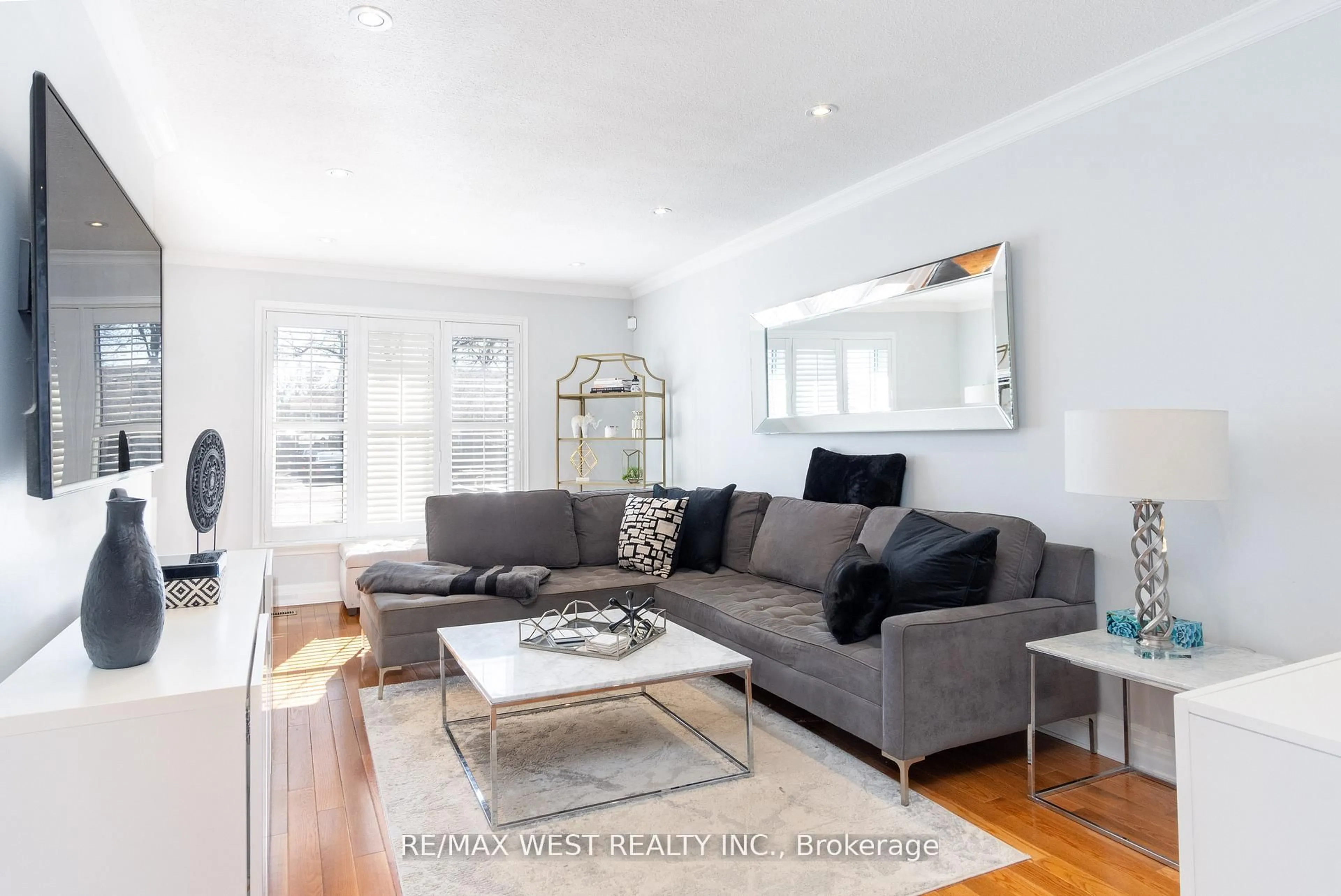 Living room with furniture, wood/laminate floor for 30 Tindale Rd, Brampton Ontario L6V 2G9