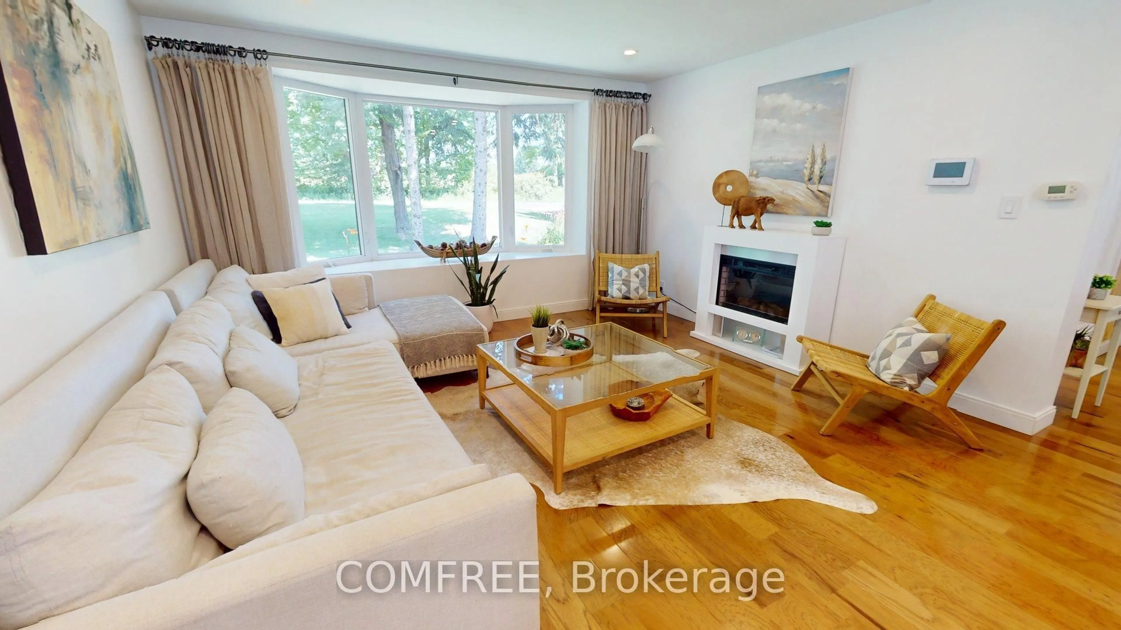 Living room with furniture, wood/laminate floor for 11022 Fifth Line, Milton Ontario N0B 2K0