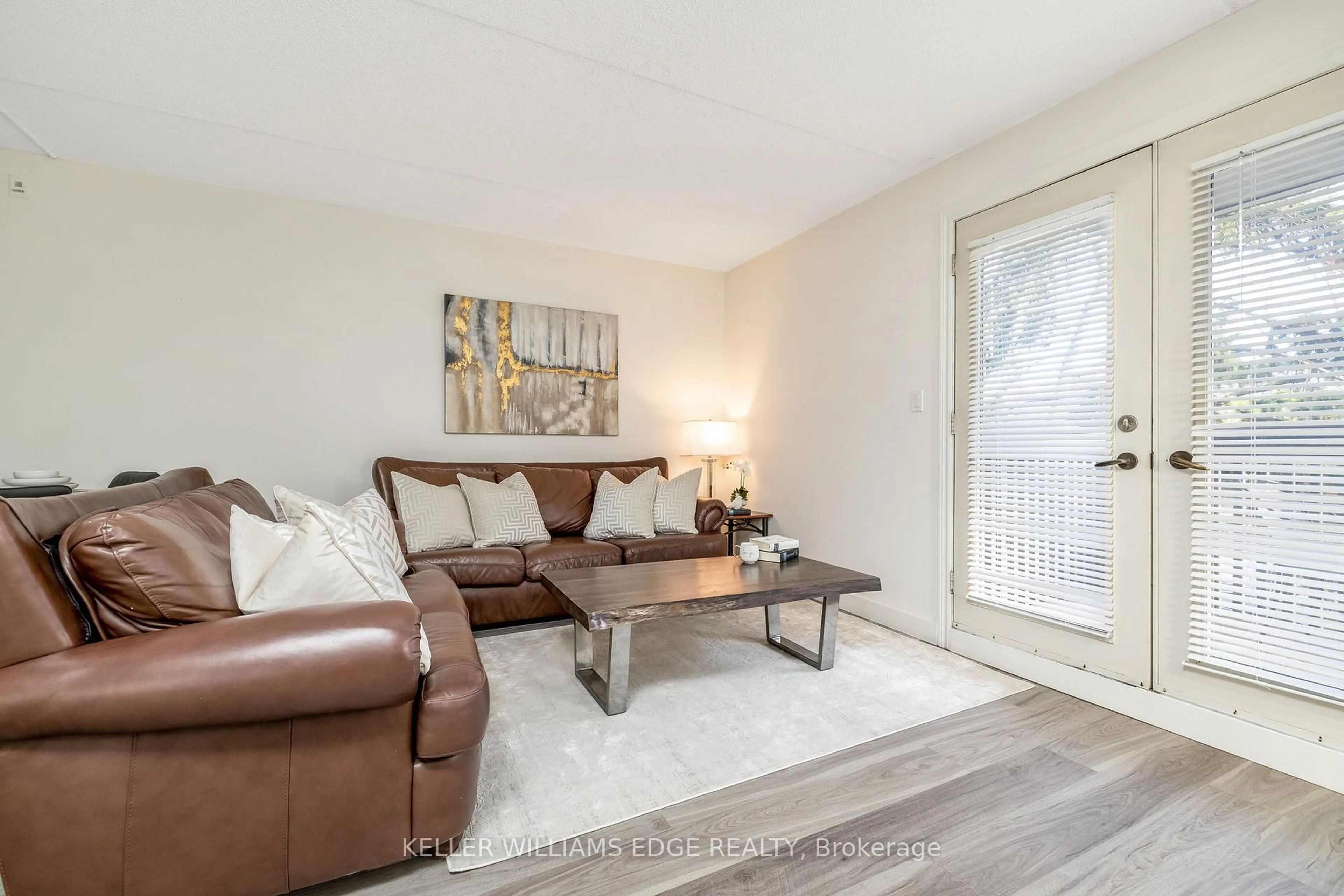 Living room with furniture, wood/laminate floor for 2030 Cleaver Ave #212, Burlington Ontario L7M 4C3