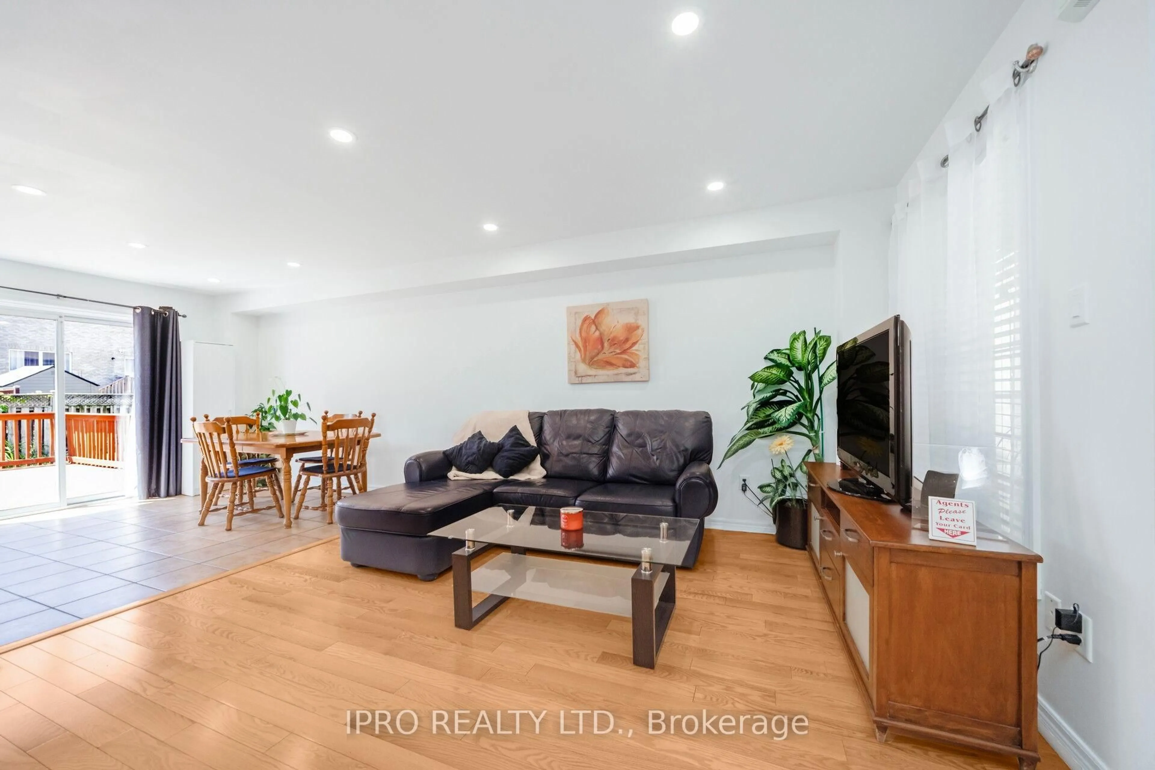 Living room with furniture, wood/laminate floor for 52 Tiller Tr, Brampton Ontario L6X 4S6