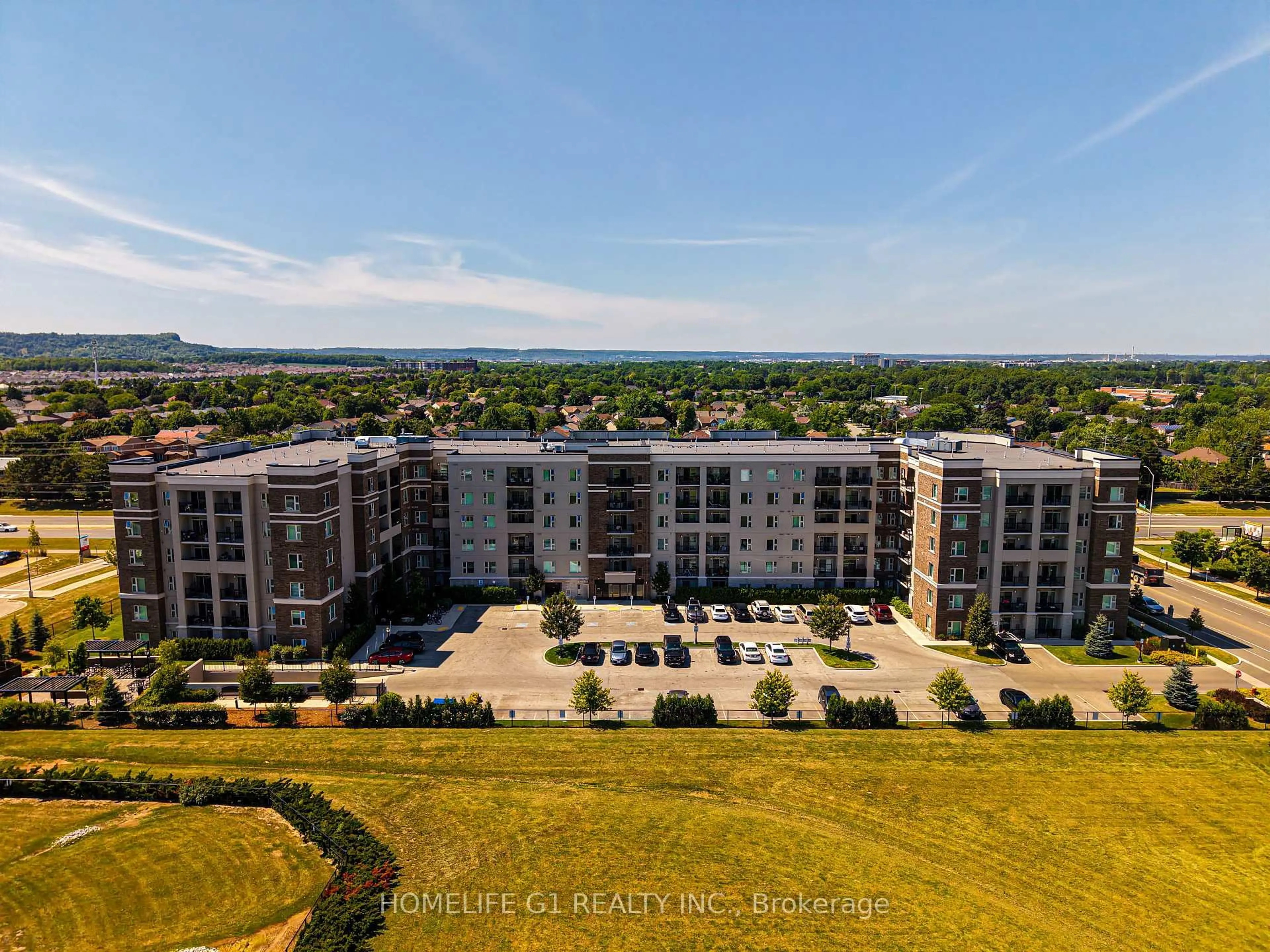 A pic from outside/outdoor area/front of a property/back of a property/a pic from drone, unknown for 610 Farmstead Dr #215, Milton Ontario L9T 8X5