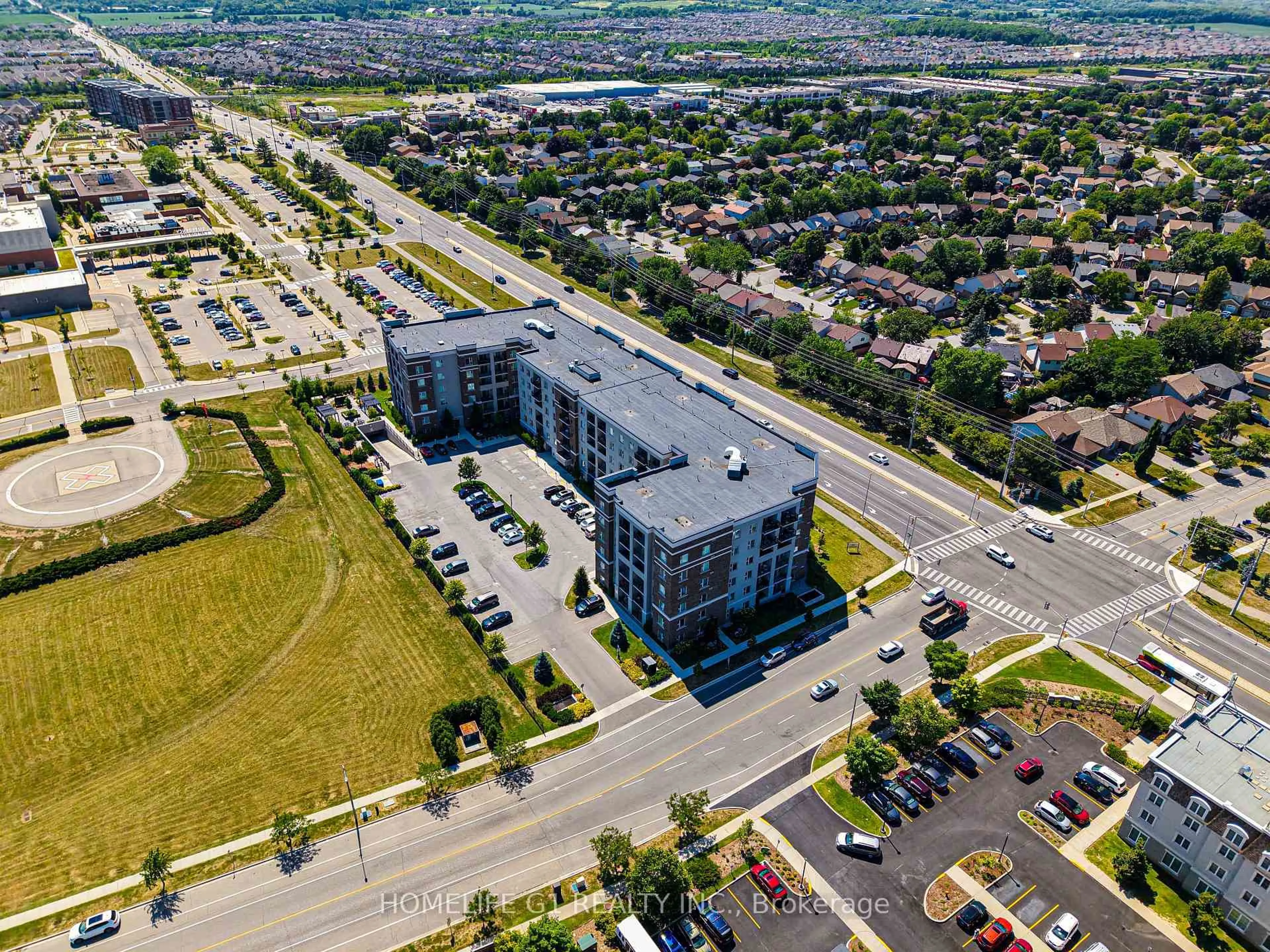 A pic from outside/outdoor area/front of a property/back of a property/a pic from drone, street for 610 Farmstead Dr #215, Milton Ontario L9T 8X5