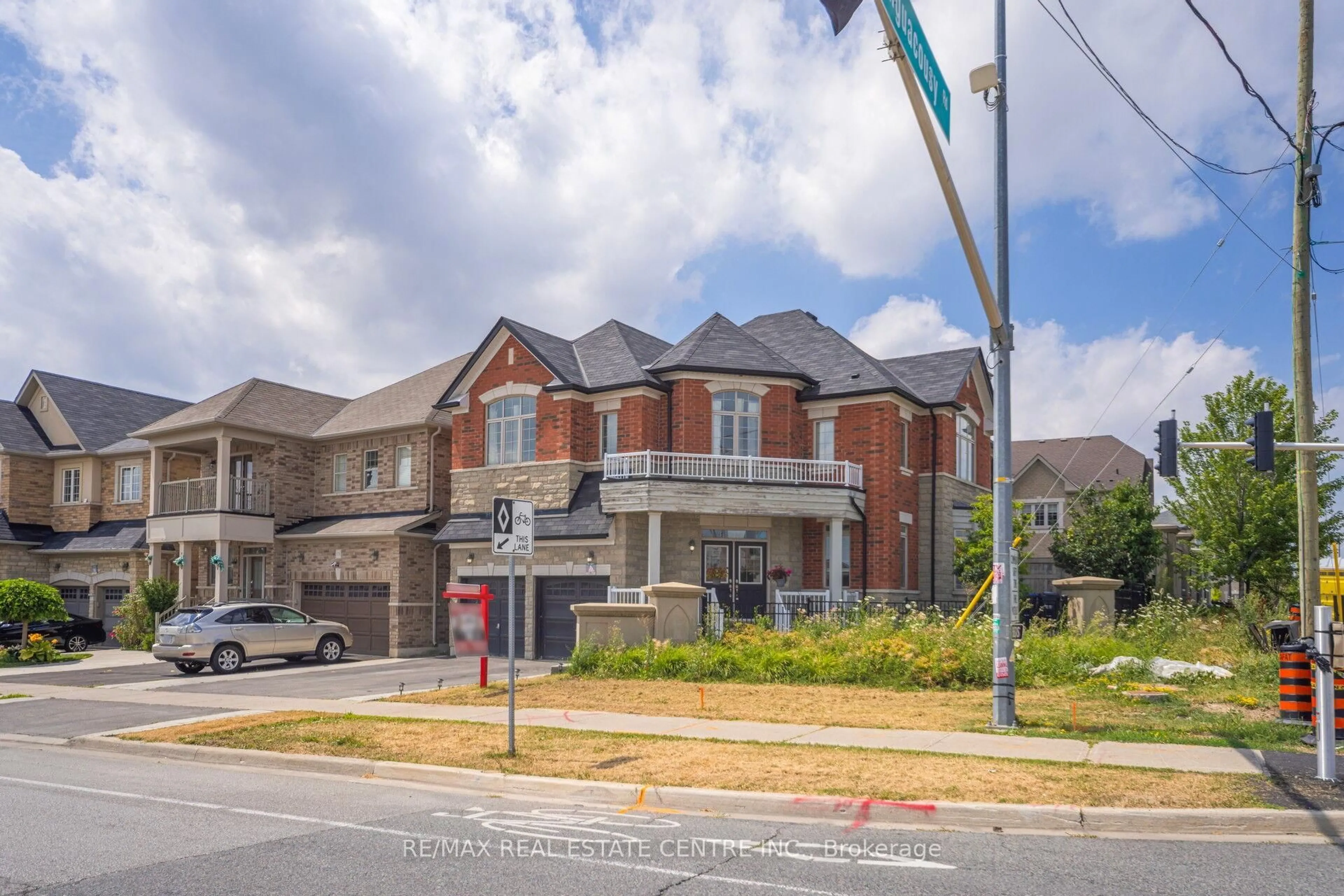 Home with brick exterior material, street for 180 Bonnie Braes Dr, Brampton Ontario L6Y 5Y7
