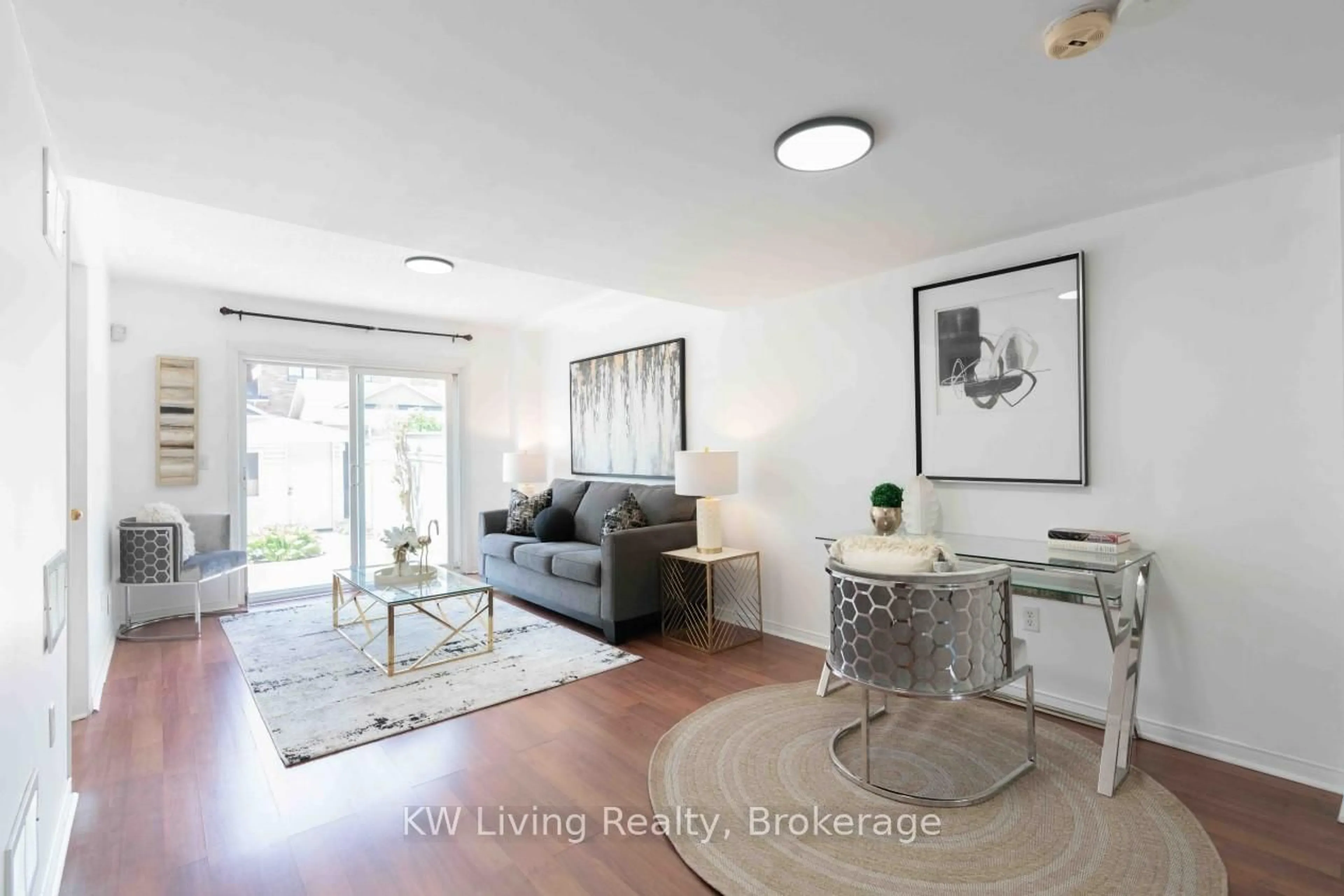 Living room with furniture, wood/laminate floor for 3599 Southwick St, Mississauga Ontario L5M 7N9