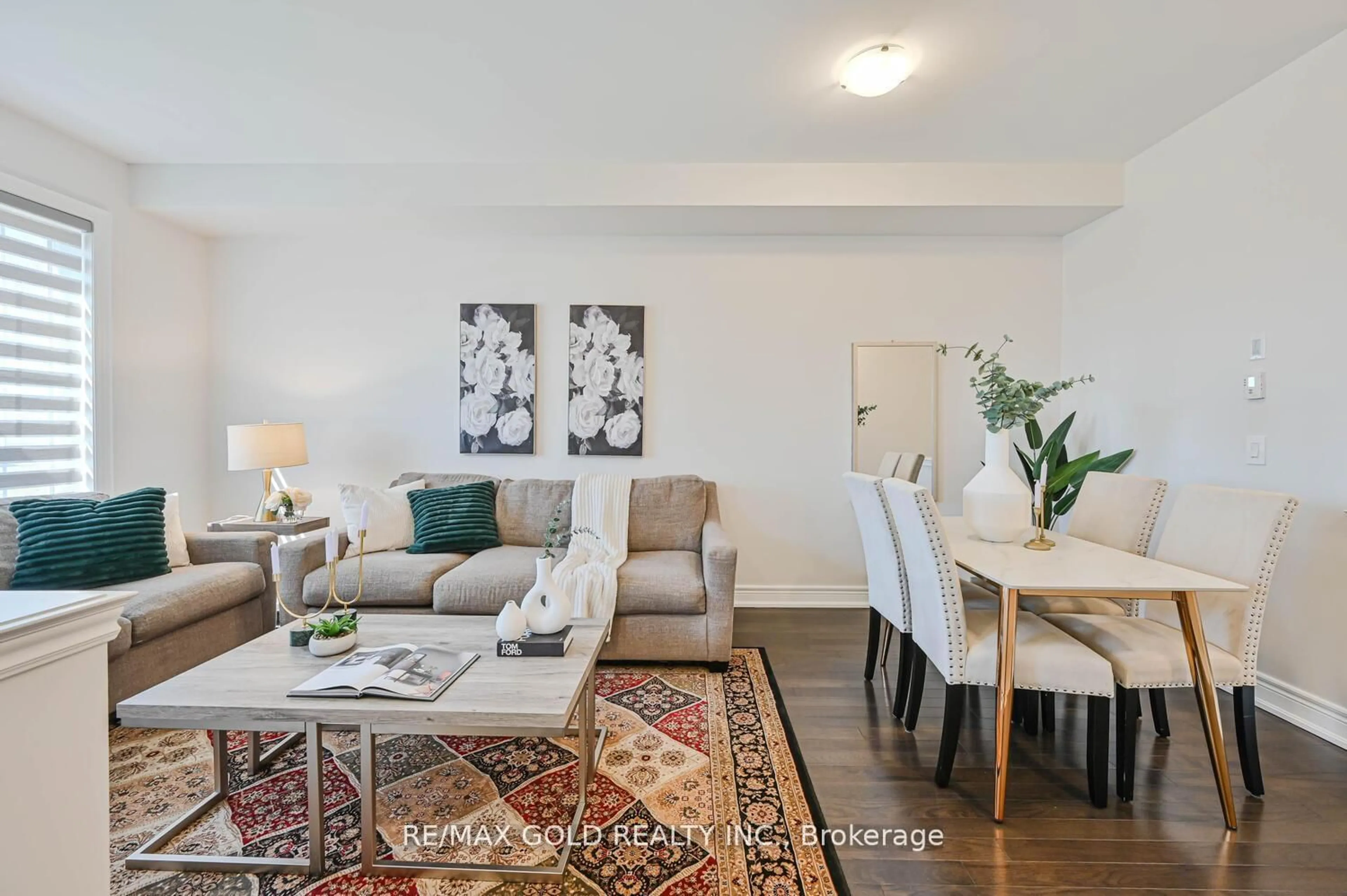 Living room with furniture, wood/laminate floor for 27 Enclave Tr, Brampton Ontario L6R 0B3