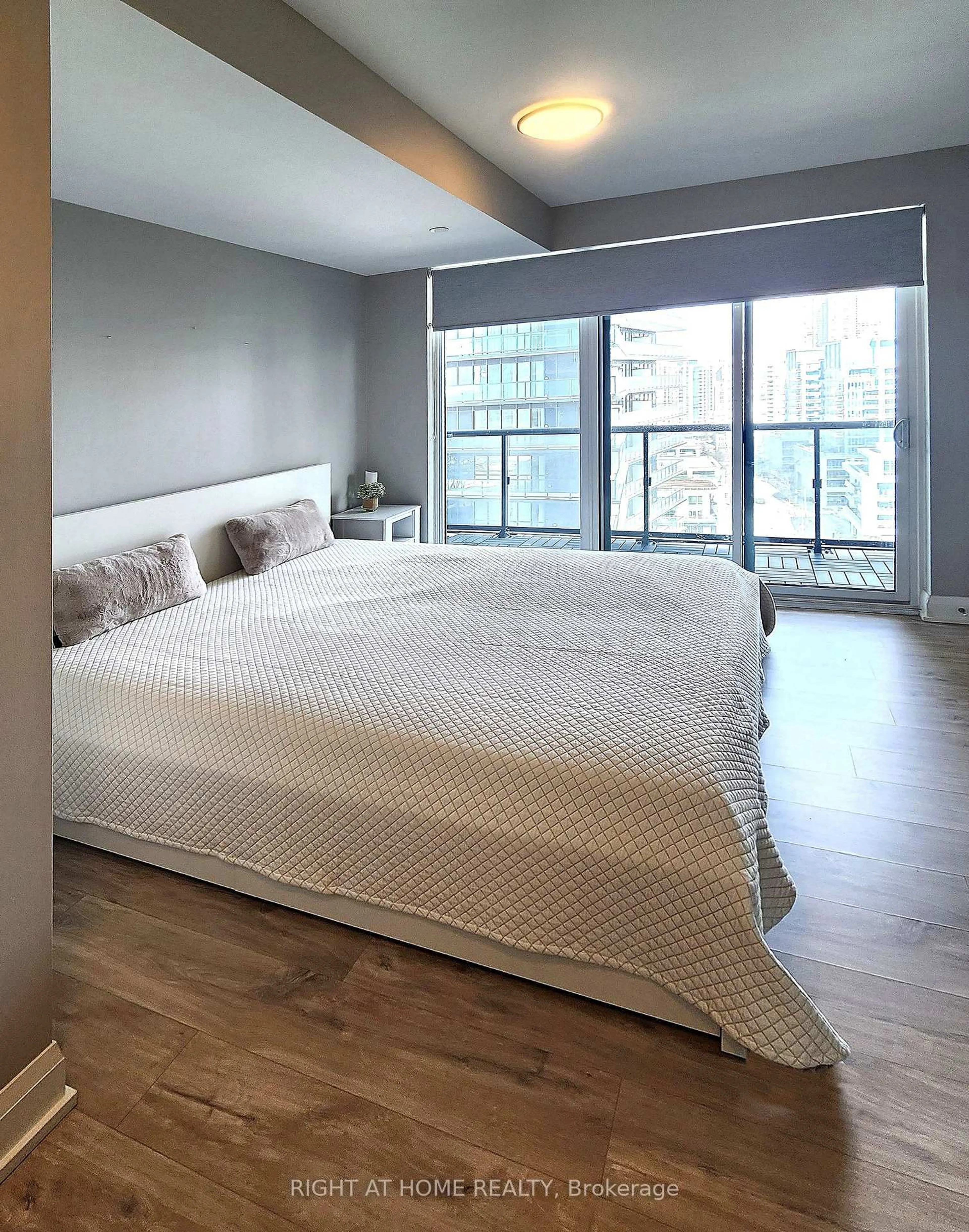 Bedroom with bed, wood/laminate floor for 56 Annie Craig Dr #1402, Toronto Ontario M8V 0C8