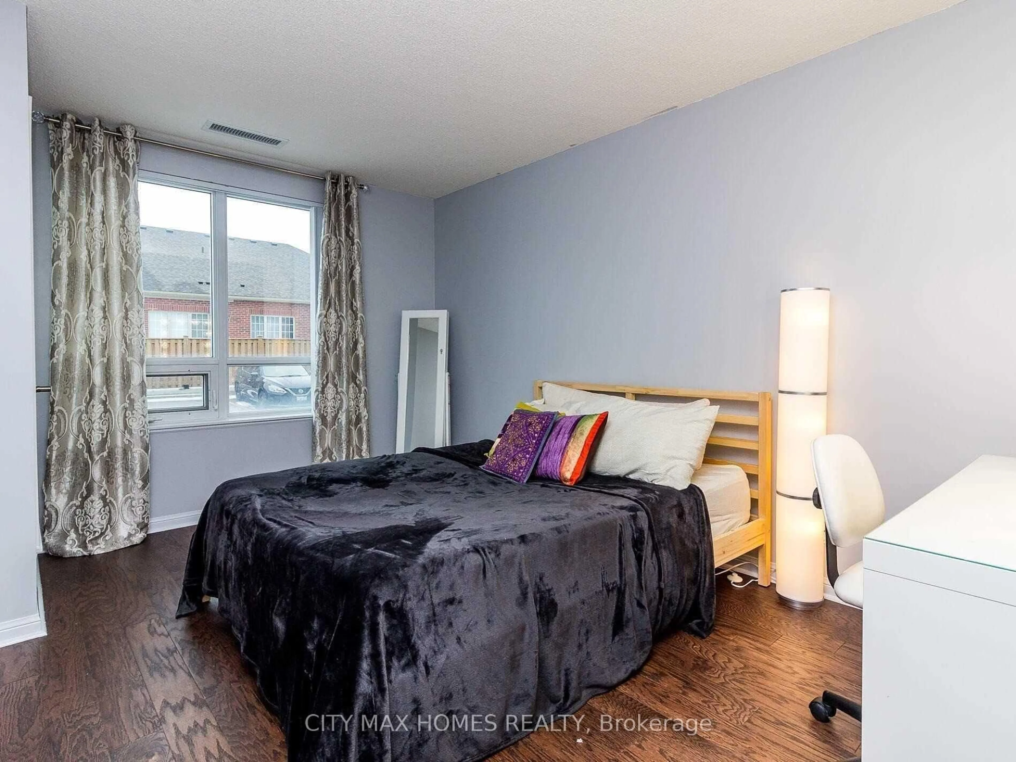 Bedroom with bed, wood/laminate floor for 50 Via Rosedale Way #116, Brampton Ontario L6R 3Z7