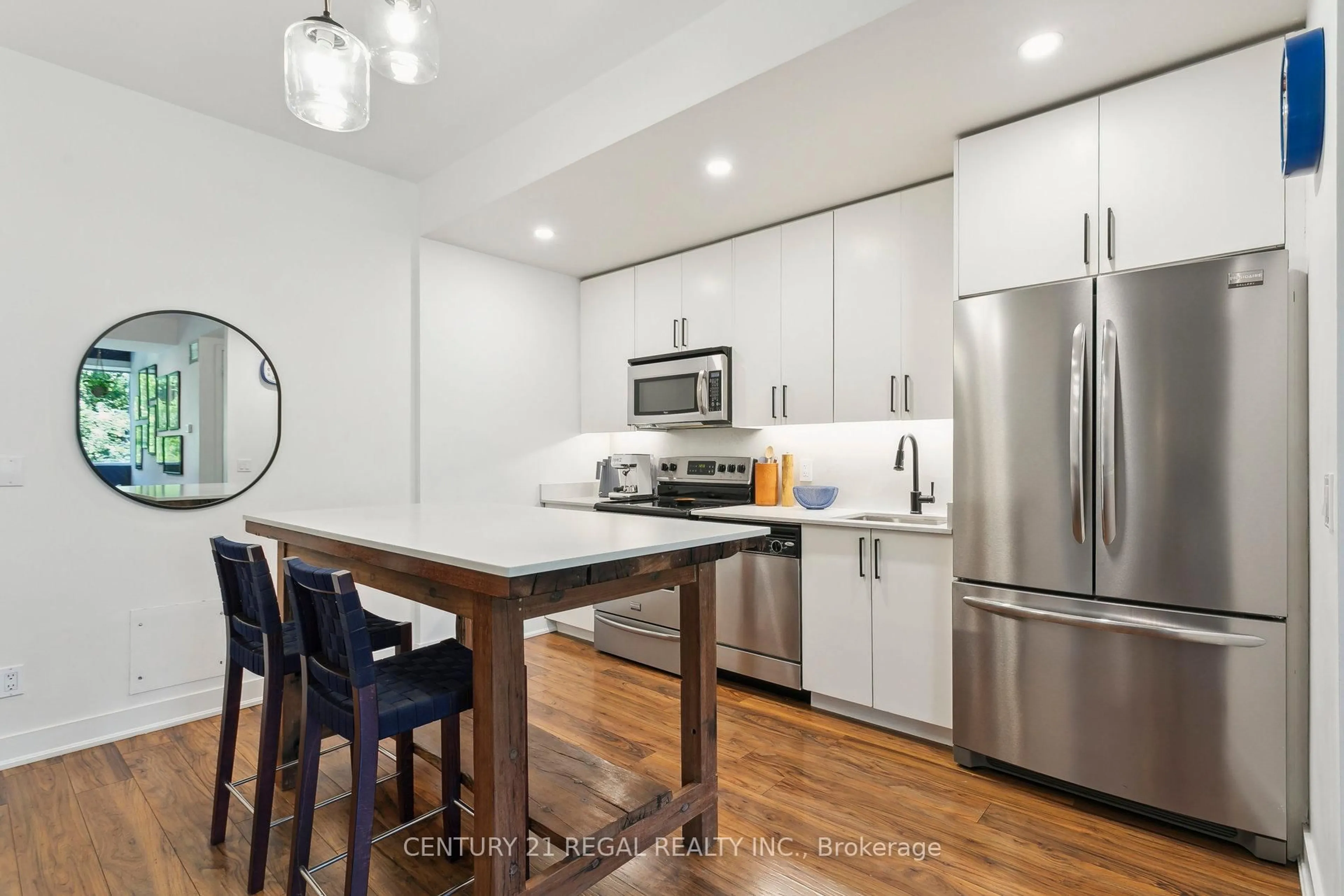 Open concept kitchen, wood/laminate floor for 25 Ritchie Ave #312, Toronto Ontario M6R 2J6