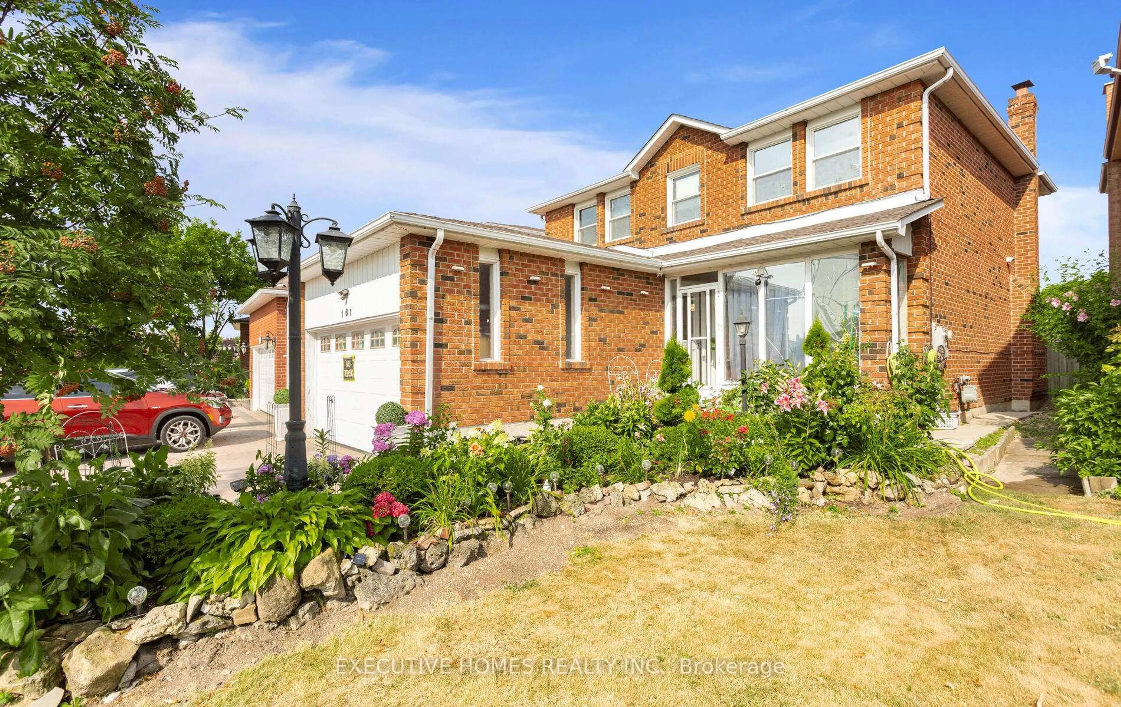 Home with brick exterior material, street for 161 Kingsbridge Garden Circ, Mississauga Ontario L5R 1T6