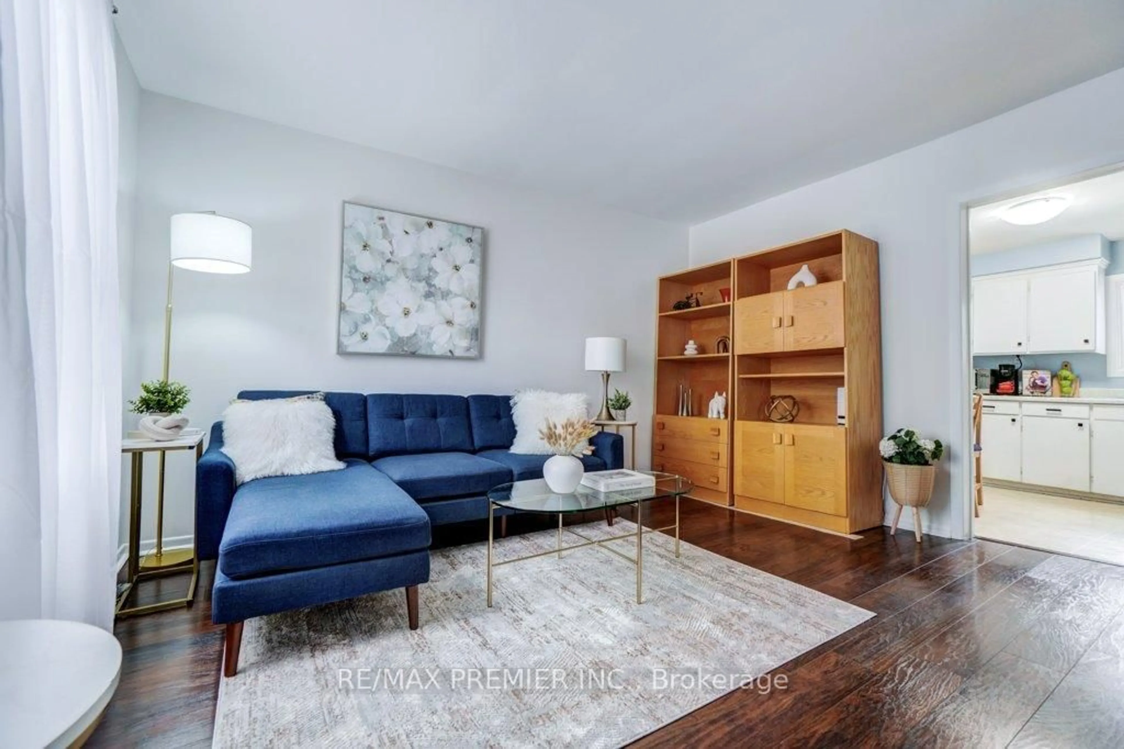 Living room with furniture, wood/laminate floor for 63 George St, Toronto Ontario M9N 2B6
