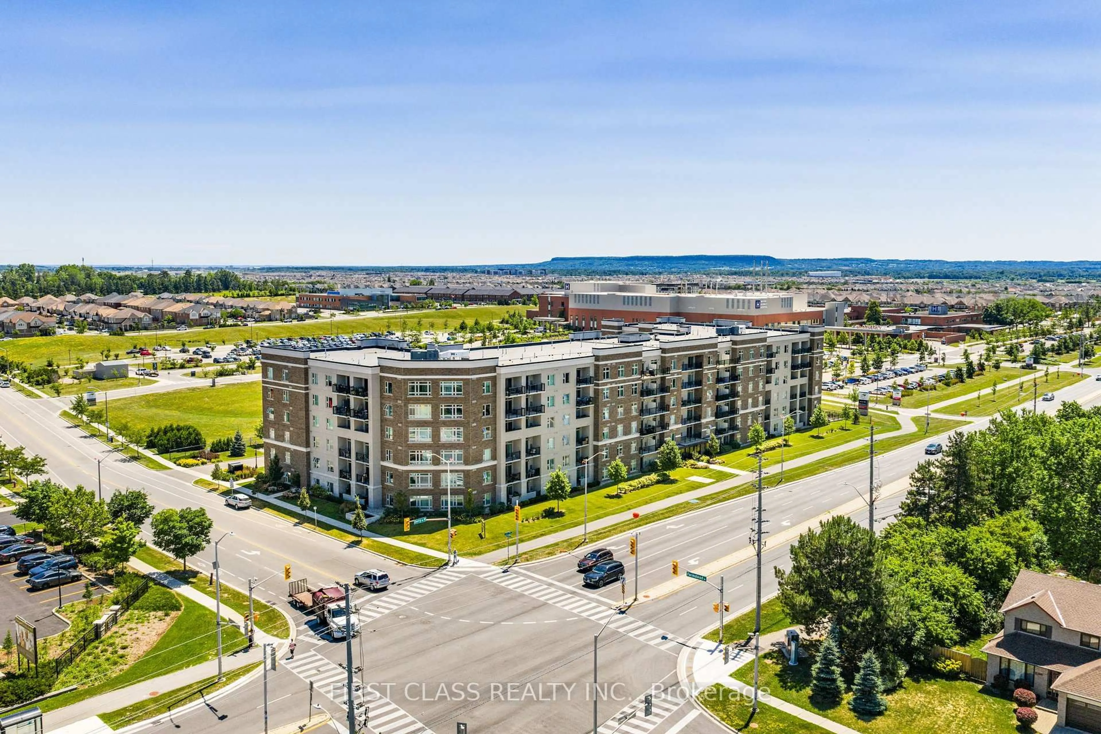 A pic from outside/outdoor area/front of a property/back of a property/a pic from drone, city buildings view from balcony for 610 Farmstead Dr #104, Milton Ontario L9T 8X5