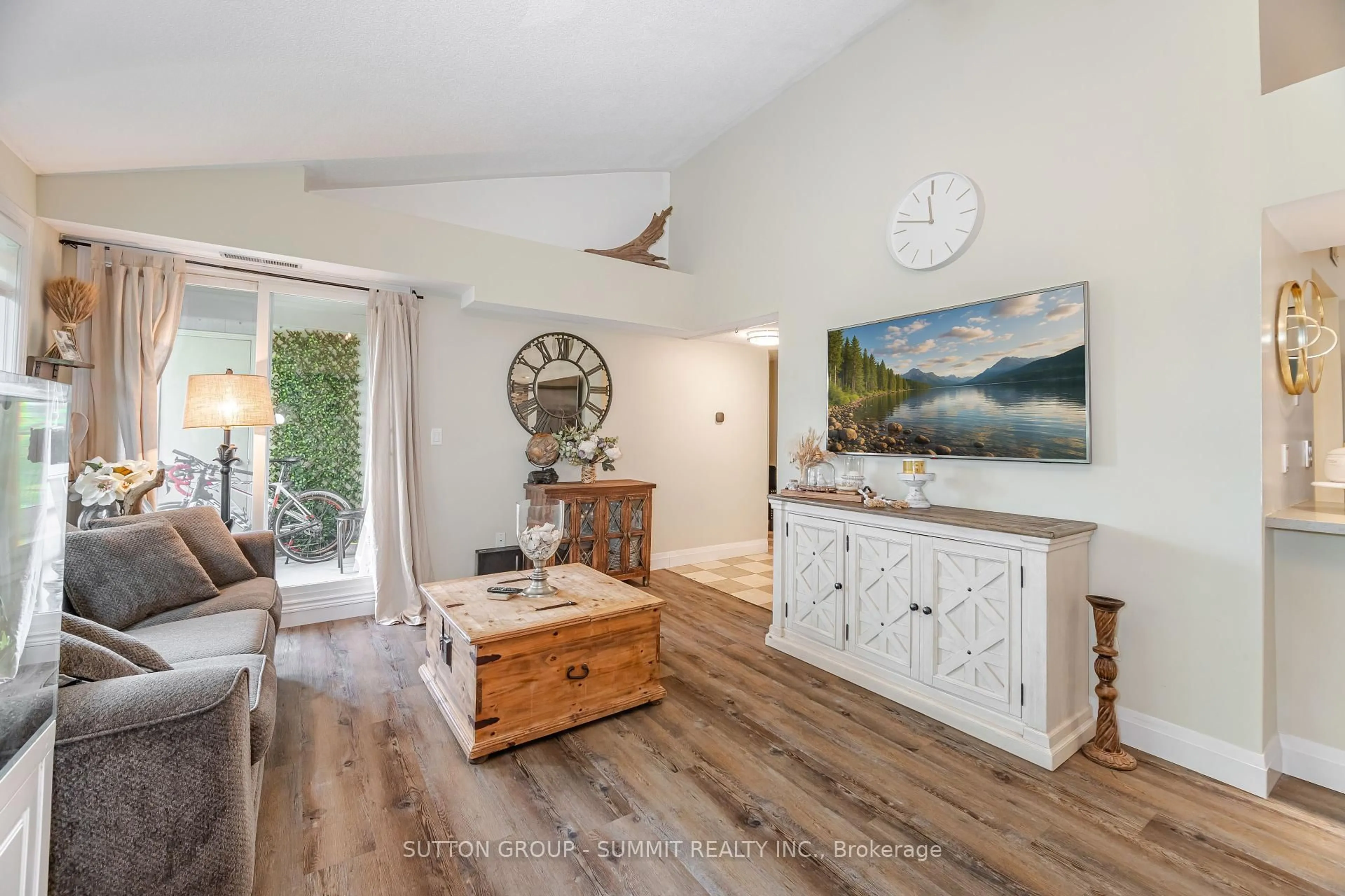 Living room with furniture, wood/laminate floor for 55 Bristol Rd #116, Mississauga Ontario L4Z 3N9