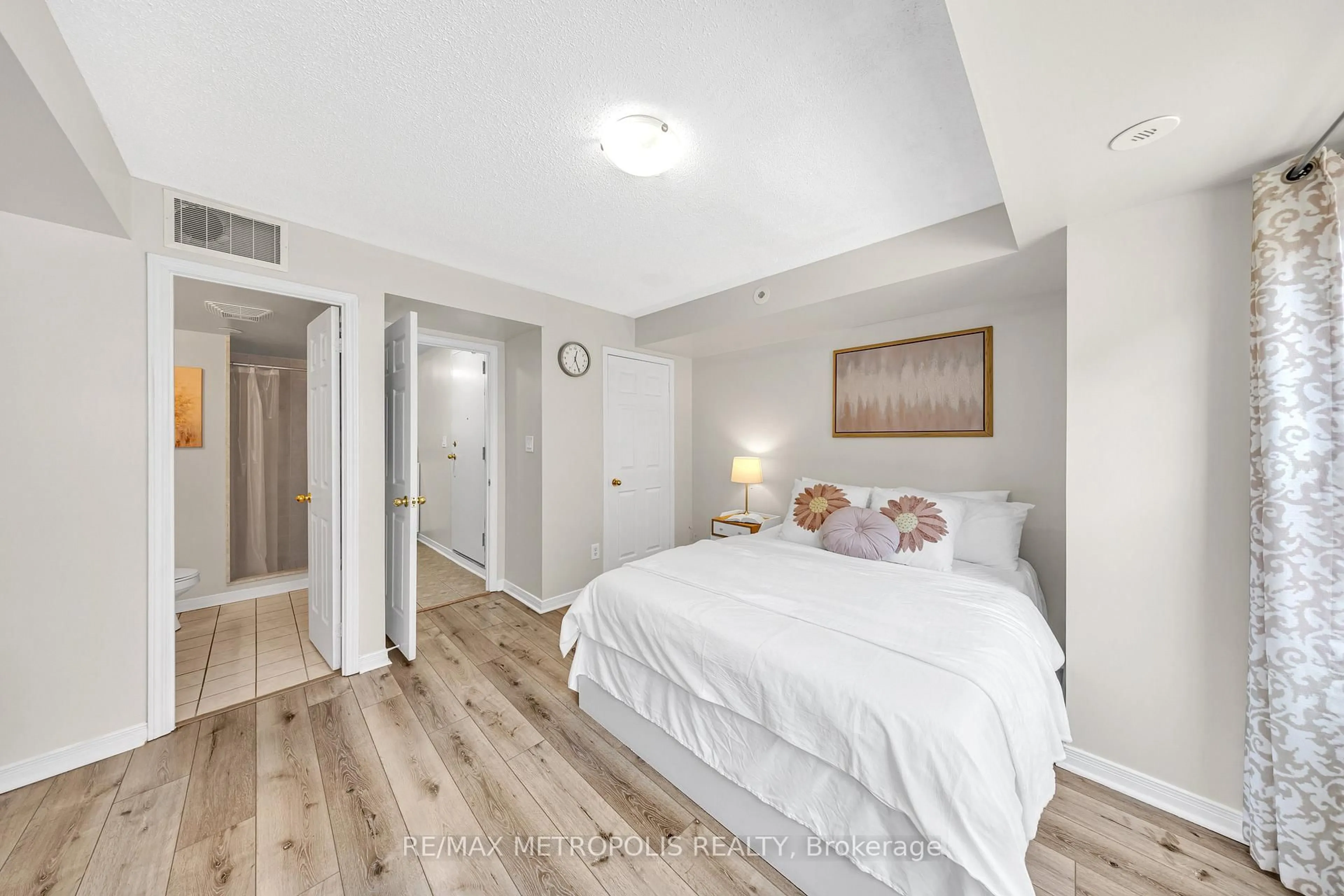 Bedroom with bed, wood/laminate floor for 37 Four Winds Dr #19, Toronto Ontario M3J 1K7