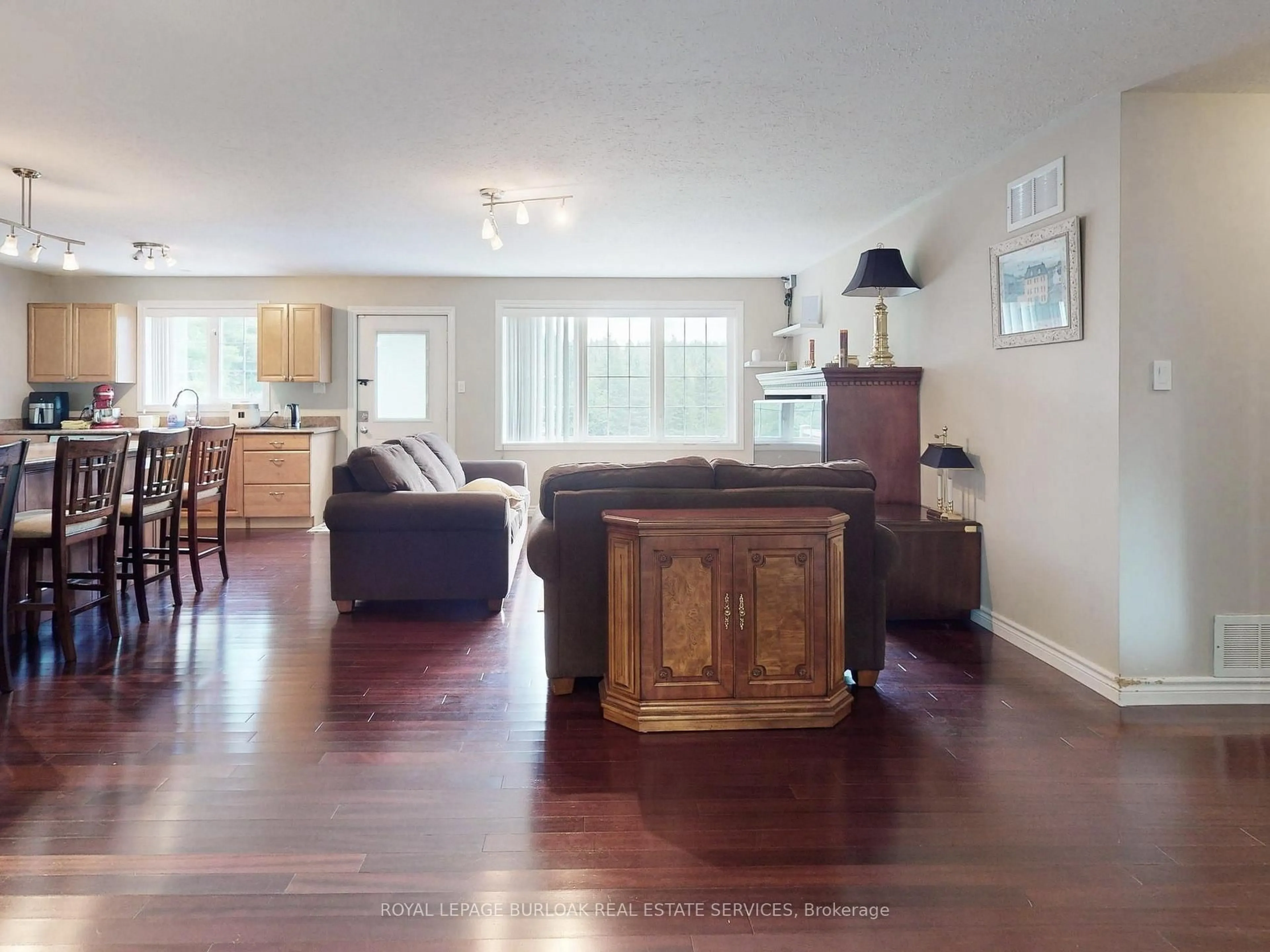 Living room with furniture, wood/laminate floor for 569 Highpoint Sdrd, Caledon Ontario L7K 0J6