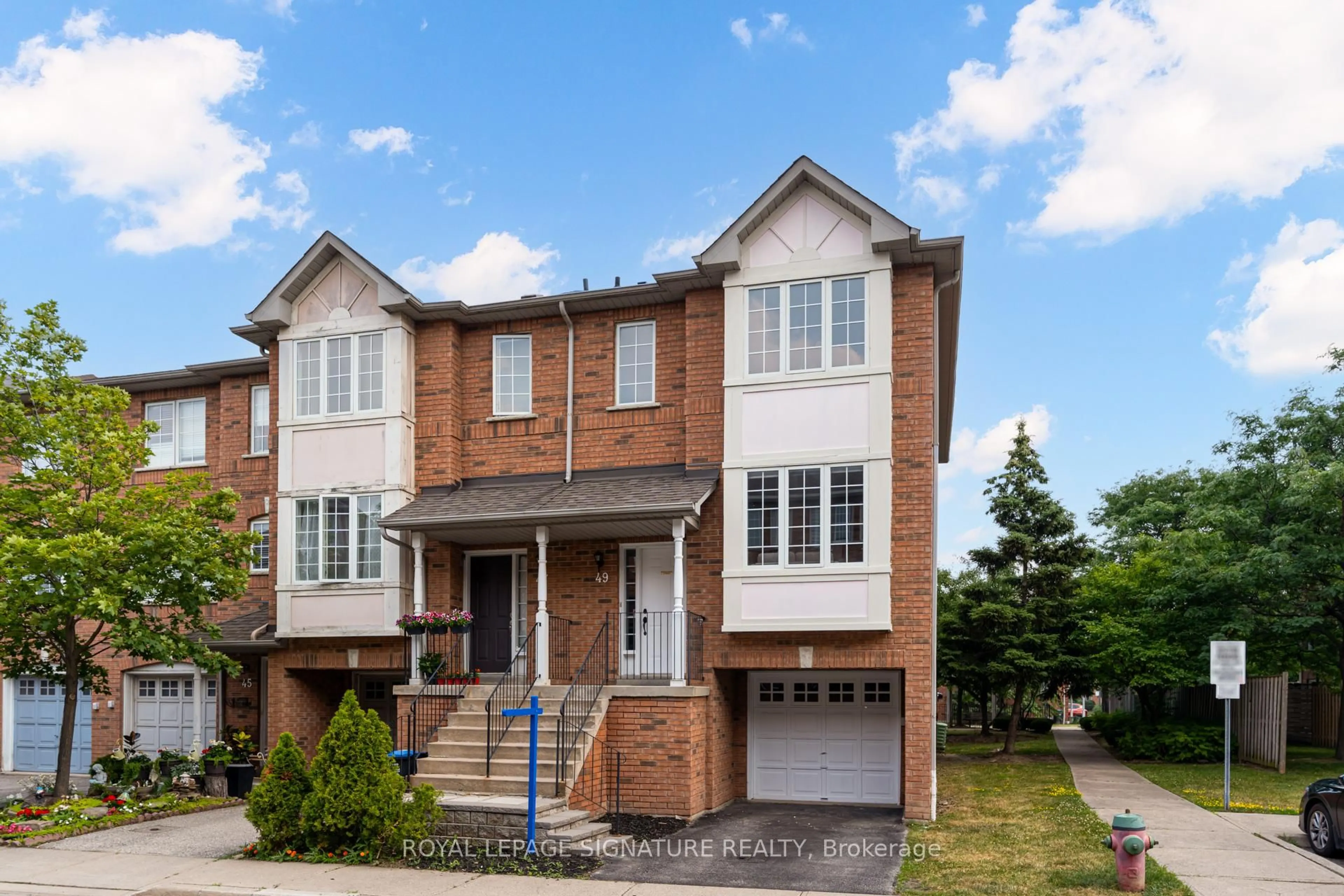 Home with brick exterior material, street for 80 Acorn Pl #49, Mississauga Ontario L4Z 4E1