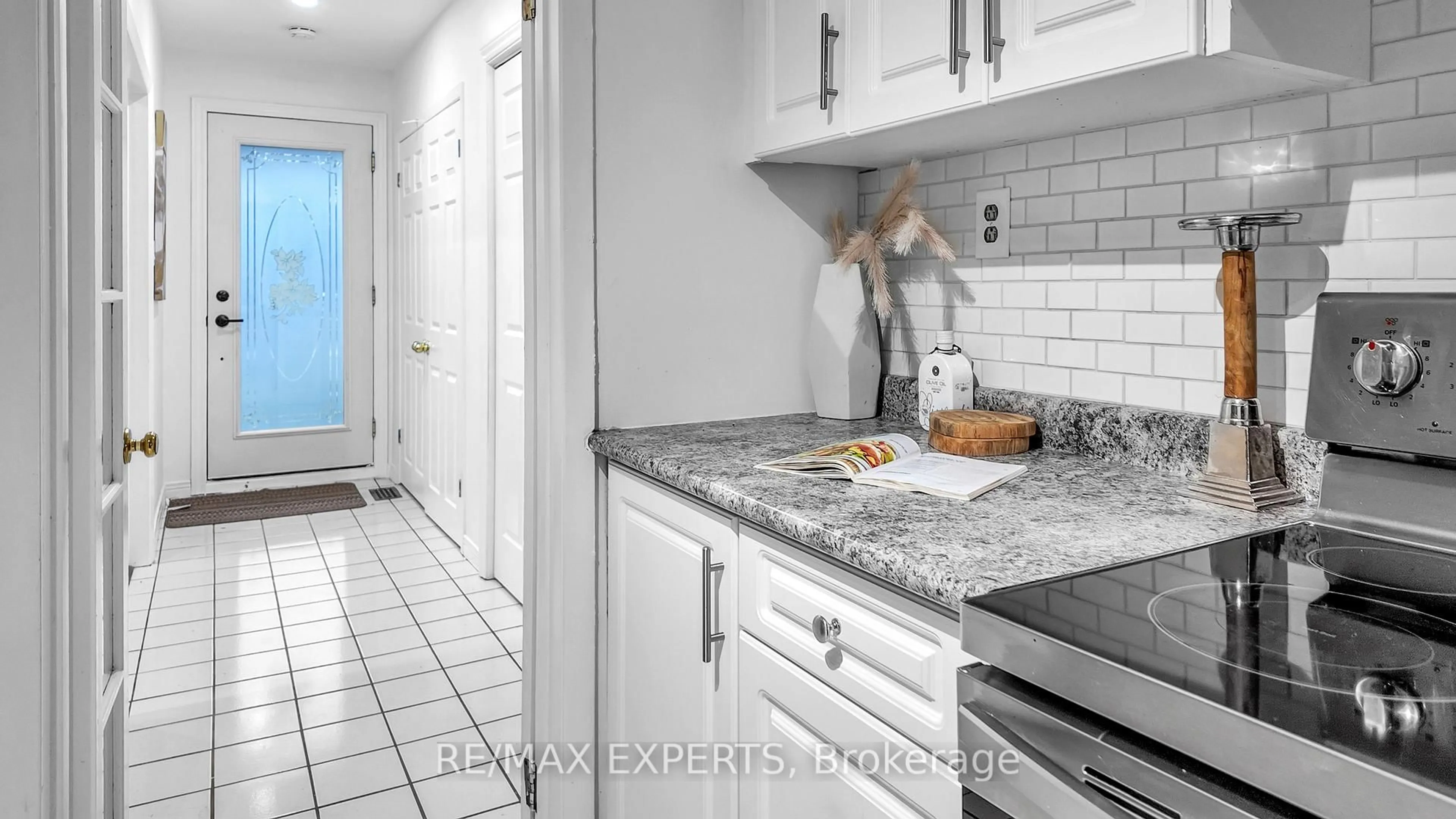 Kitchen with laundary machines, ceramic/tile floor for 615 Walkers Line, Burlington Ontario L7N 2E6