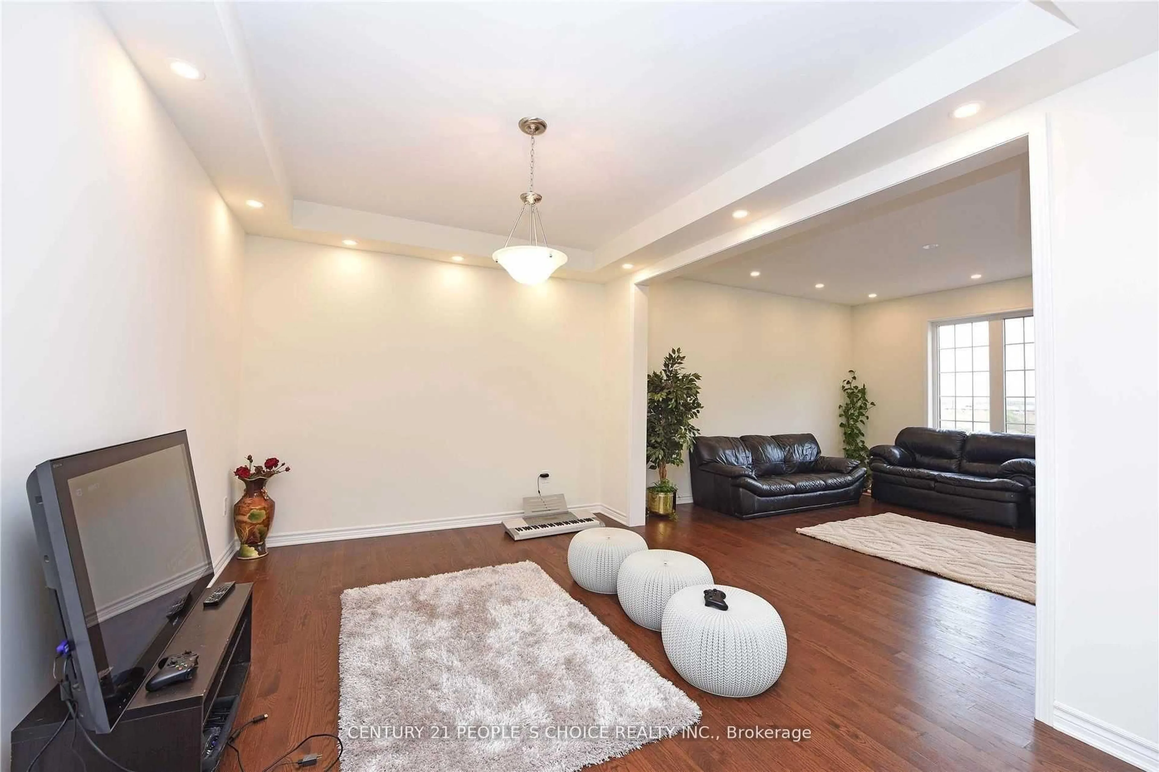 Living room with furniture, wood/laminate floor for 249 Hinton Terr, Milton Ontario L9E 1C8