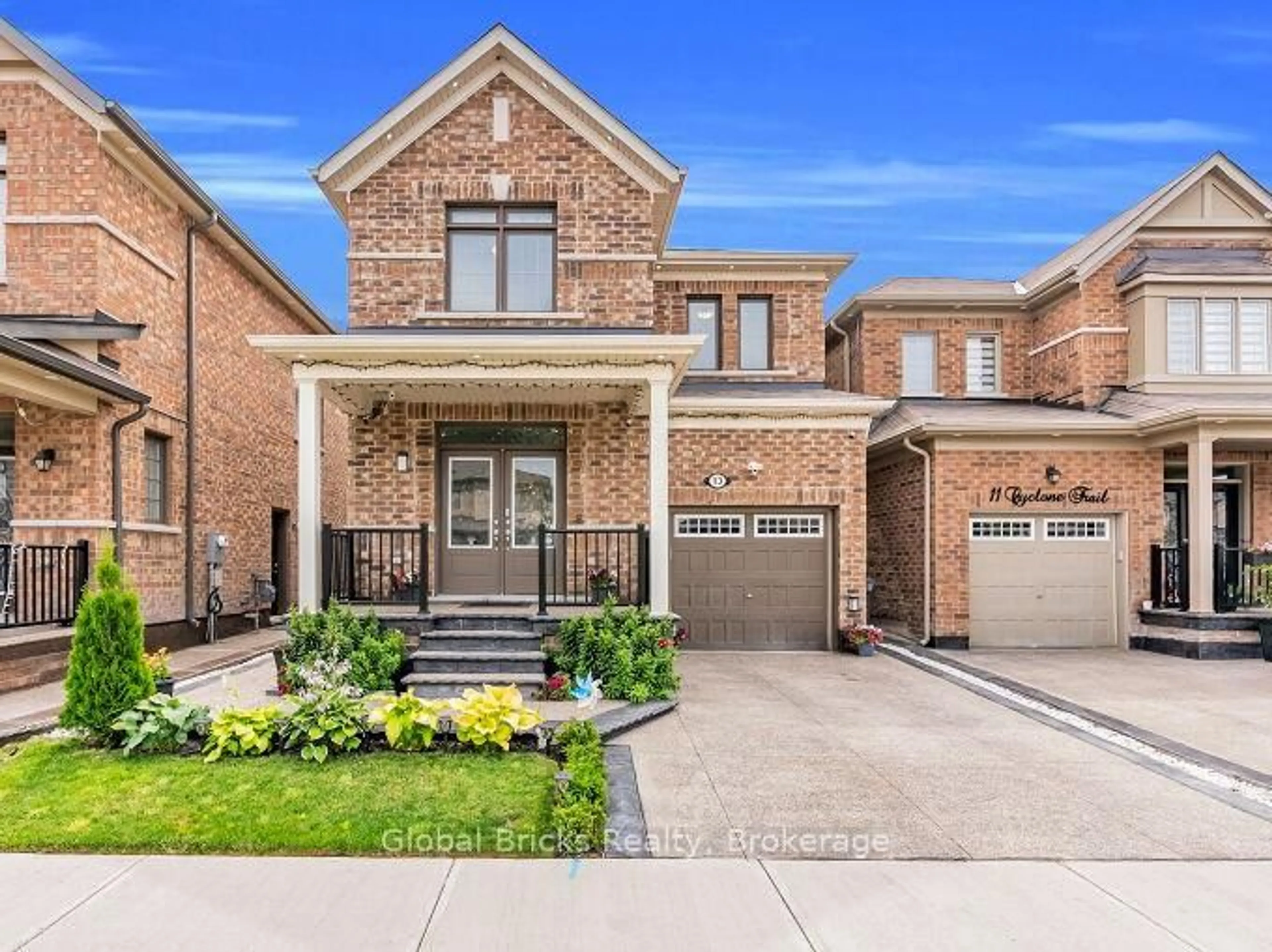 Home with brick exterior material, street for 13 Cyclone Tr, Brampton Ontario L7A 5E8