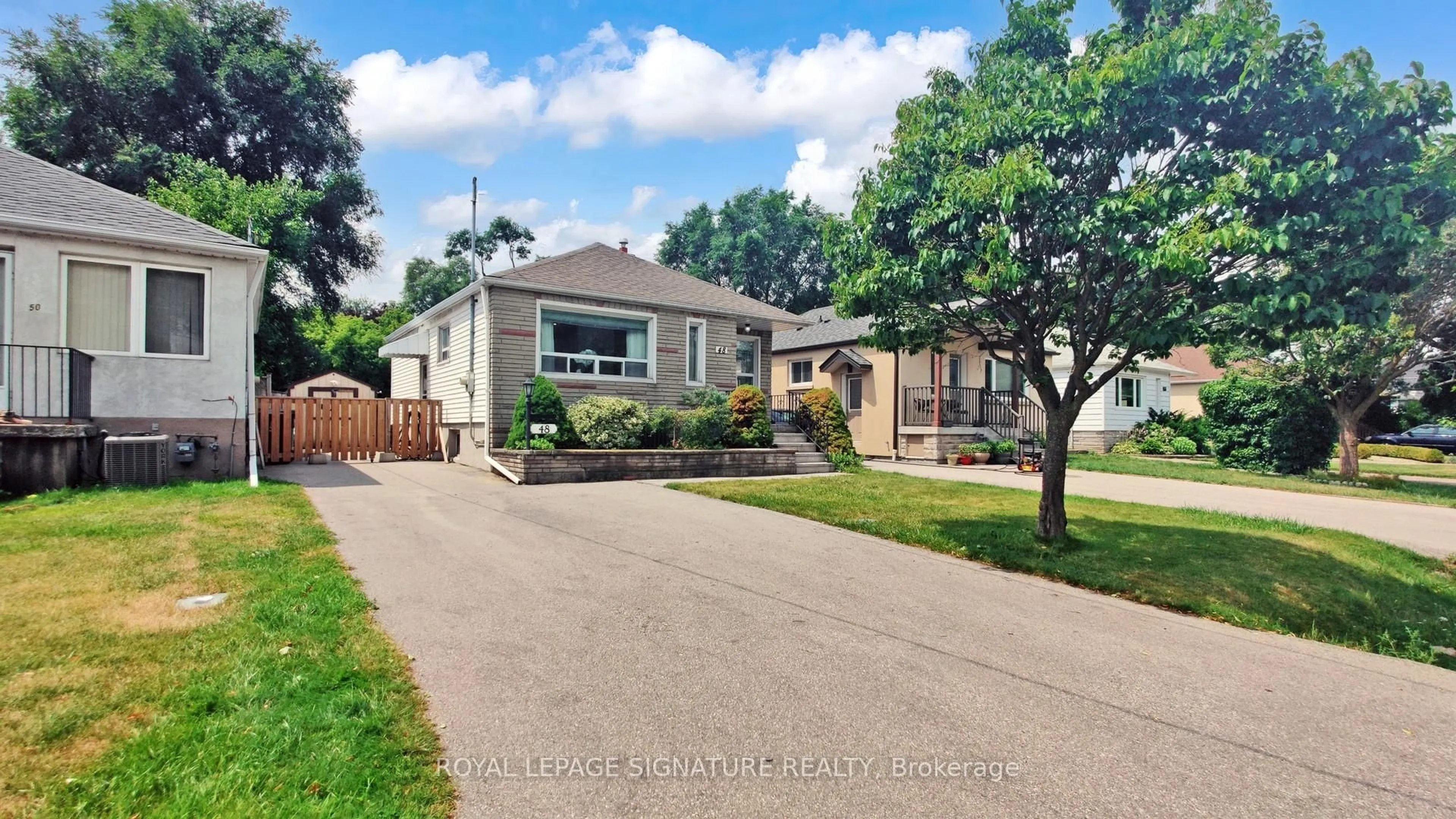 Home with brick exterior material, street for 48 Acorn Ave, Toronto Ontario M9B 3P9