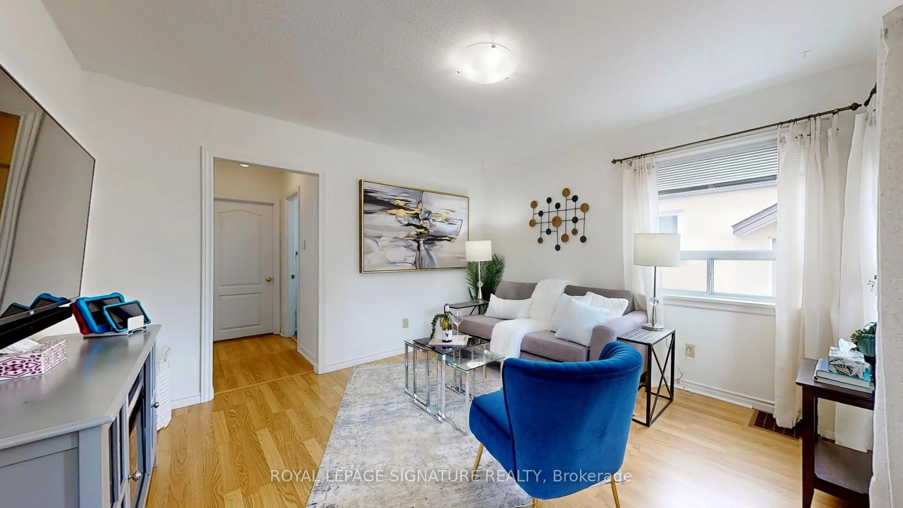 Living room with furniture, wood/laminate floor for 48 Acorn Ave, Toronto Ontario M9B 3P9